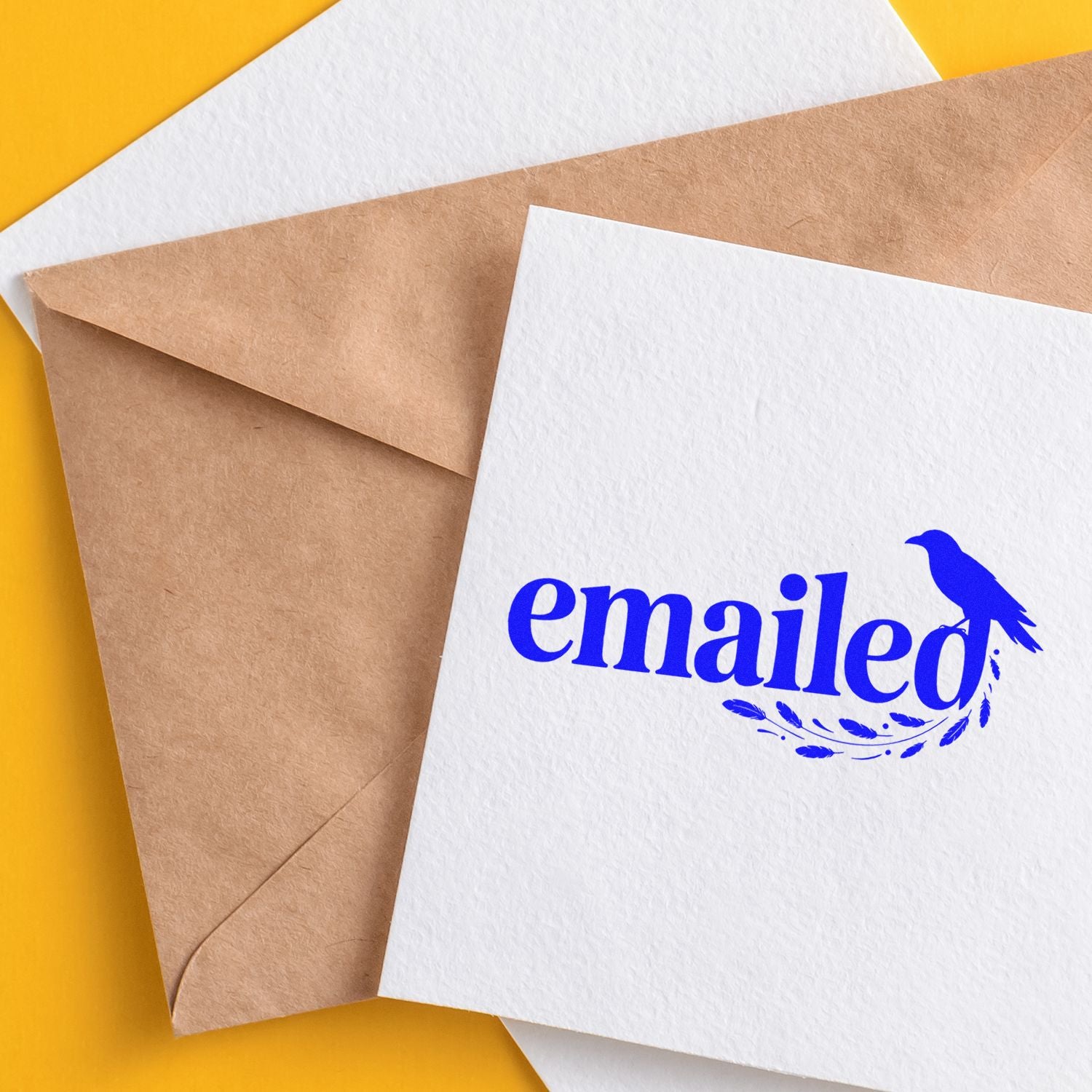 Blue emailed rubber stamp on envelope for marking sent mail and business correspondence.