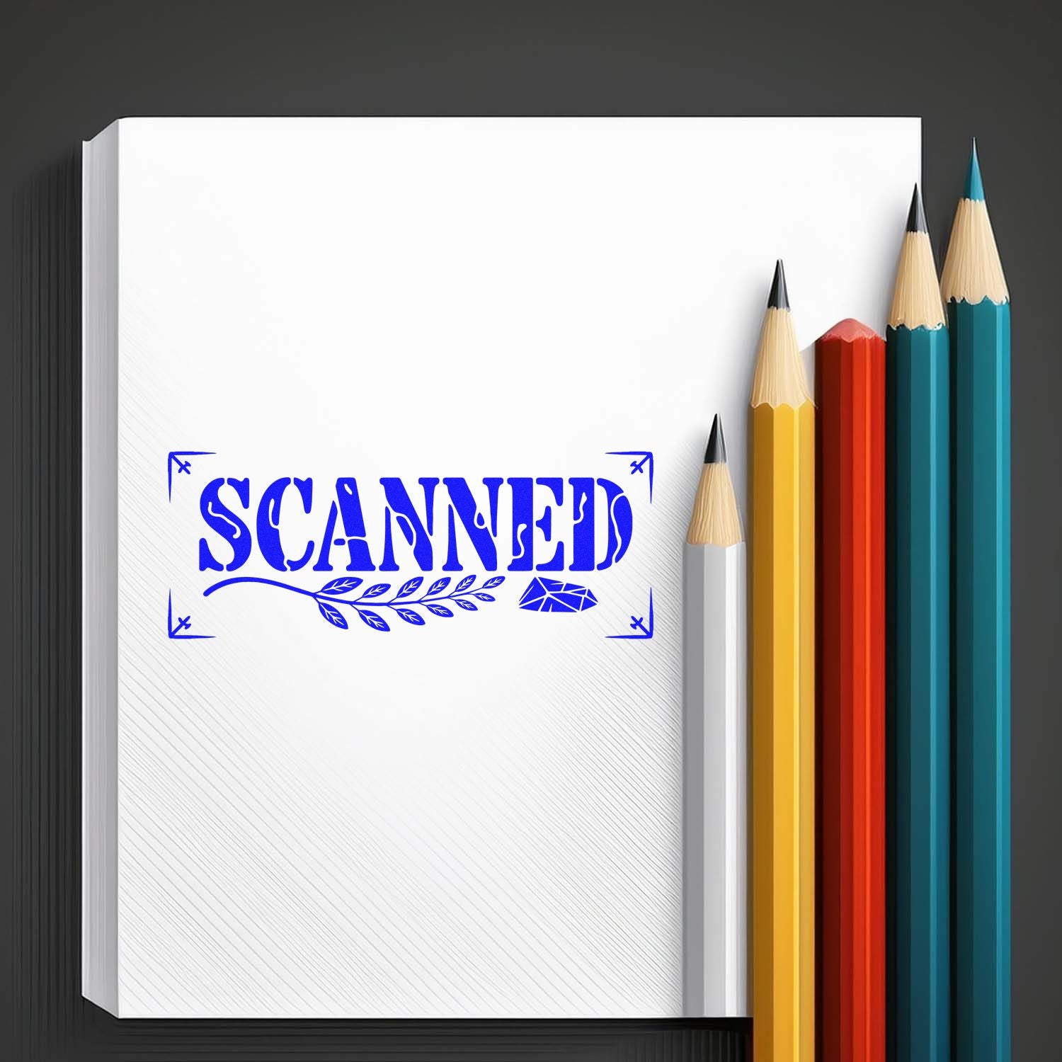 Blue scanned rubber stamp on notebook beside colored pencils, ideal for office document marking.