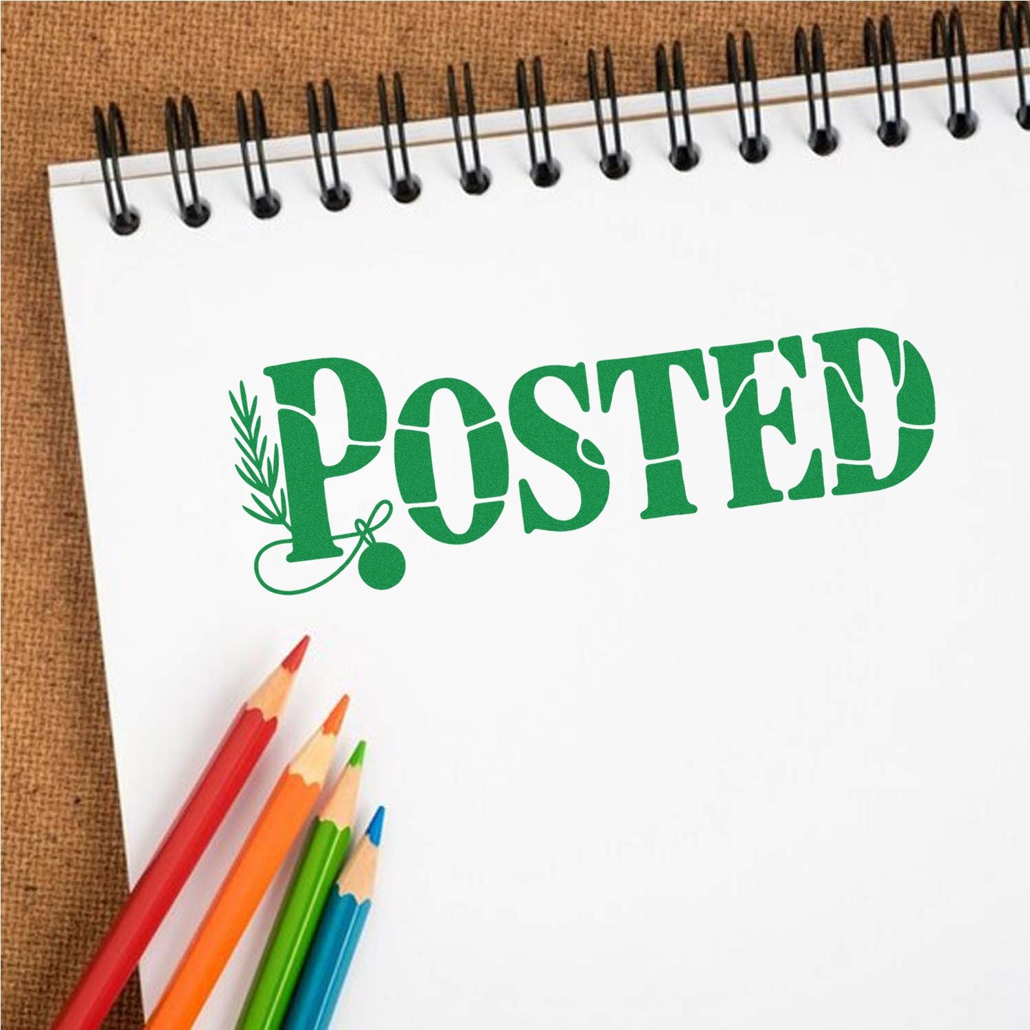 Green POSTED rubber stamp on notebook page, ideal for office mail, document approval, and processing marks.