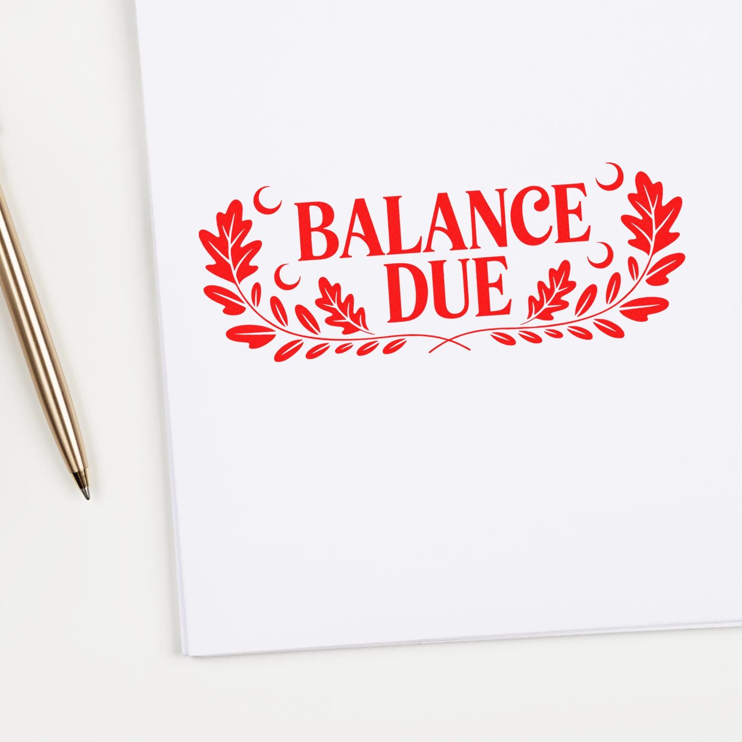 Red Balance Due rubber stamp on white paper beside pen, ideal for invoices, billing, and payment reminder notices.
