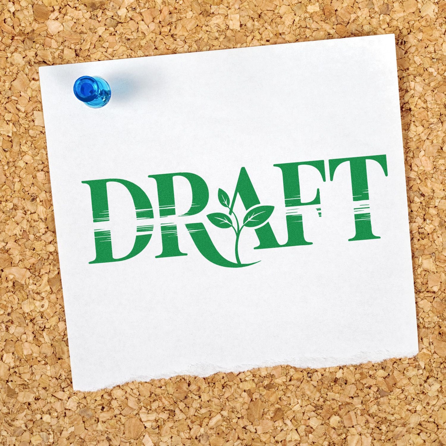Green DRAFT rubber stamp on pinned paper, marking a document as a draft with eco leaf design on corkboard.