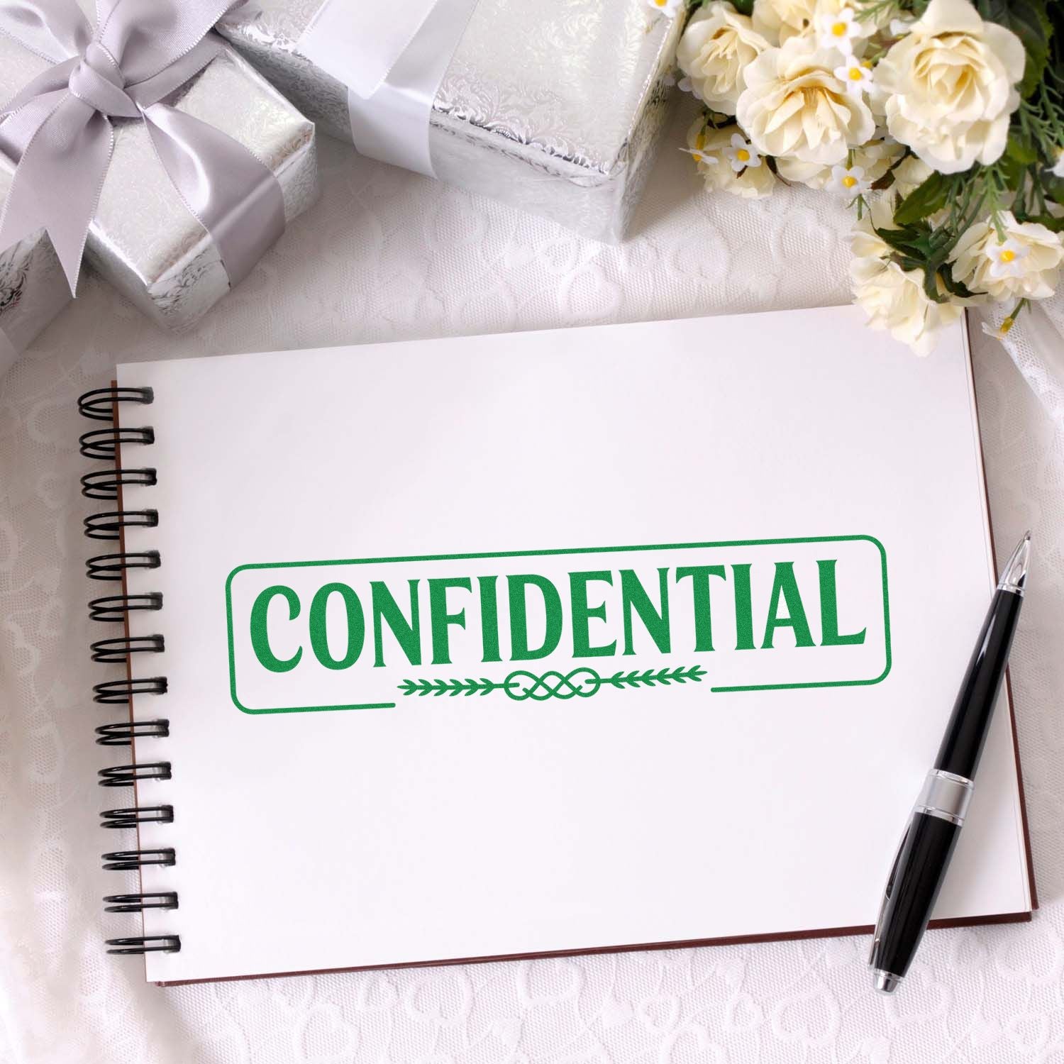 Confidential rubber stamp on notebook, ideal for marking documents, office files, and privacy labeling.