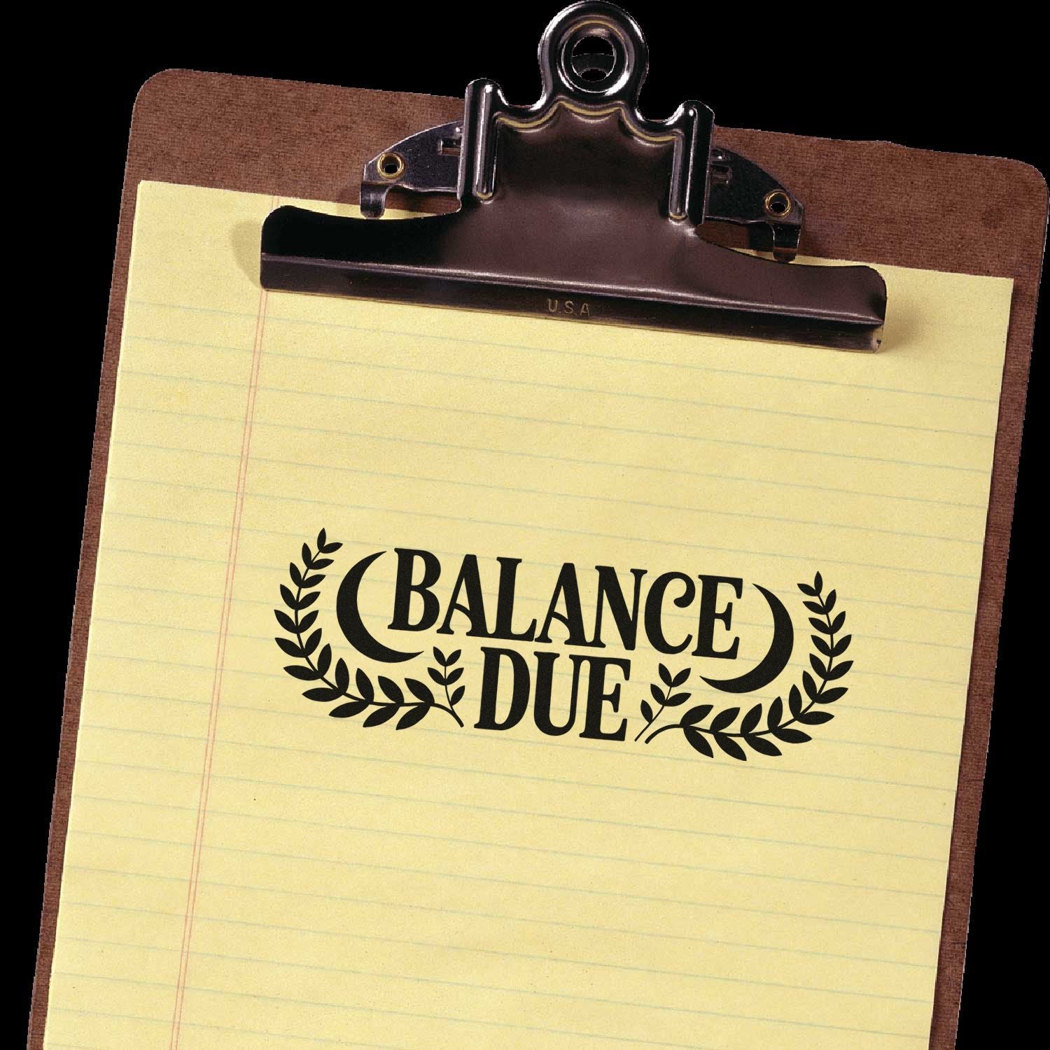 Balance Due rubber stamp on clipboard paper, ideal for billing, invoices, and overdue payment reminders.