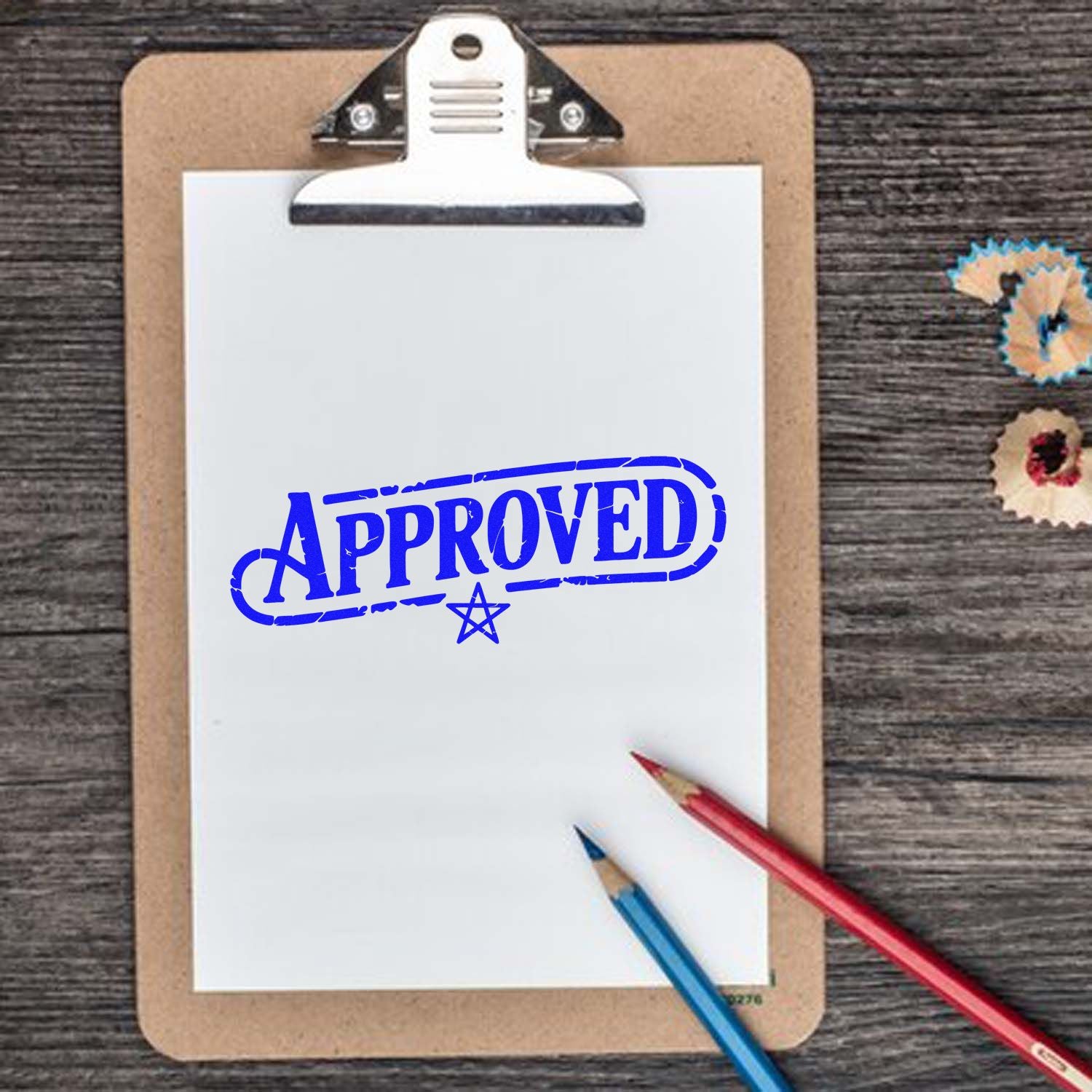 Approved rubber stamp impression on clipboard paper, ideal for office approval marking.