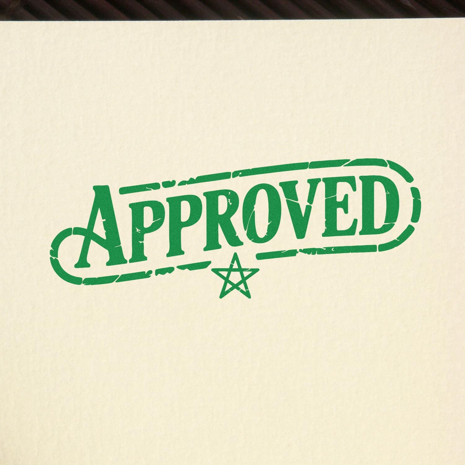 Green APPROVED rubber stamp with star, ideal for marking documents, packaging, or quality control approval.