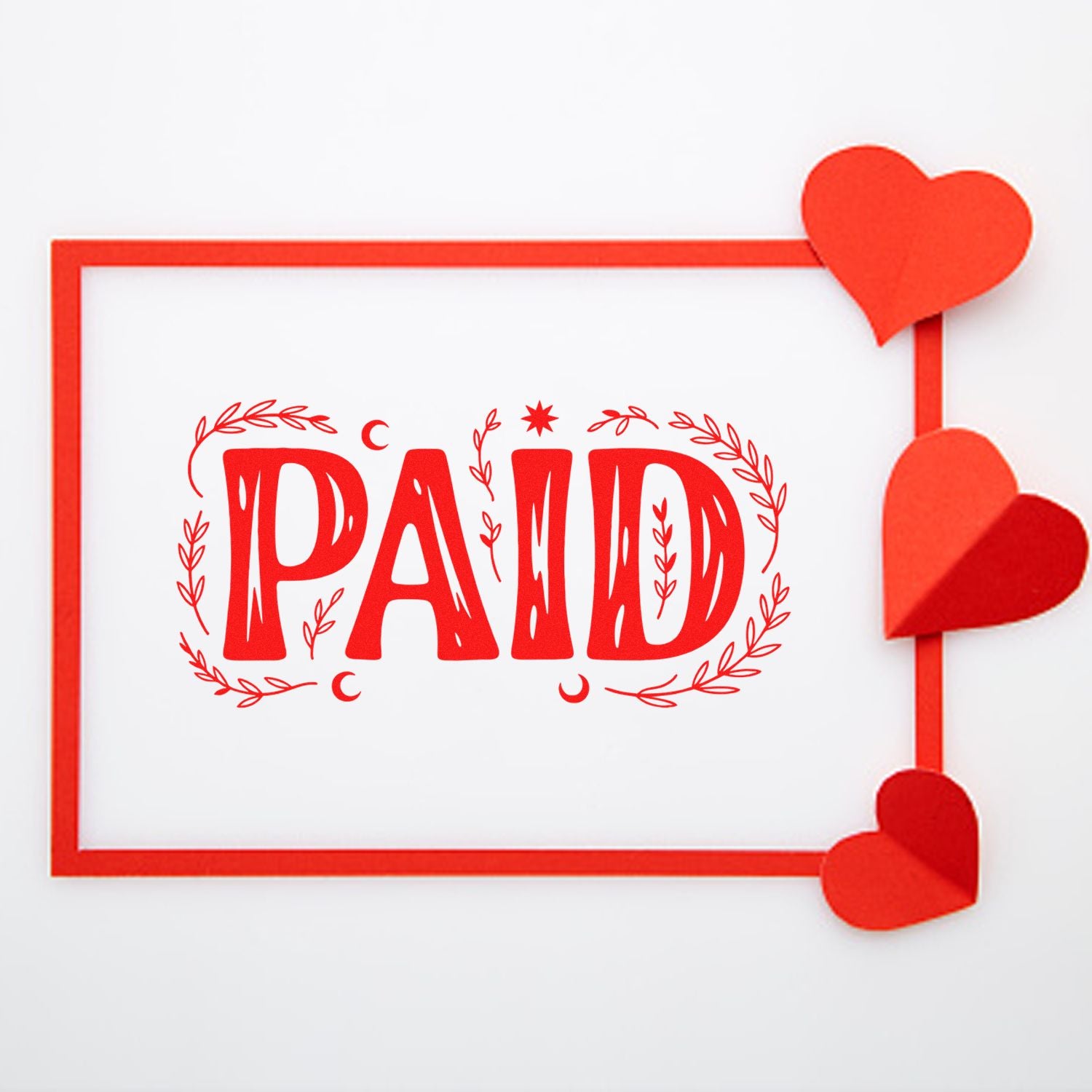 Red PAID rubber stamp with heart accents for invoices, receipts, and payment confirmation.