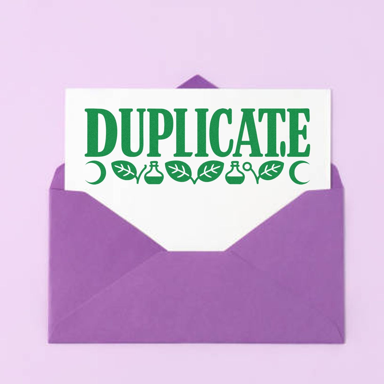 Duplicate rubber stamp design on a purple envelope with green lettering for office mail and record labeling.