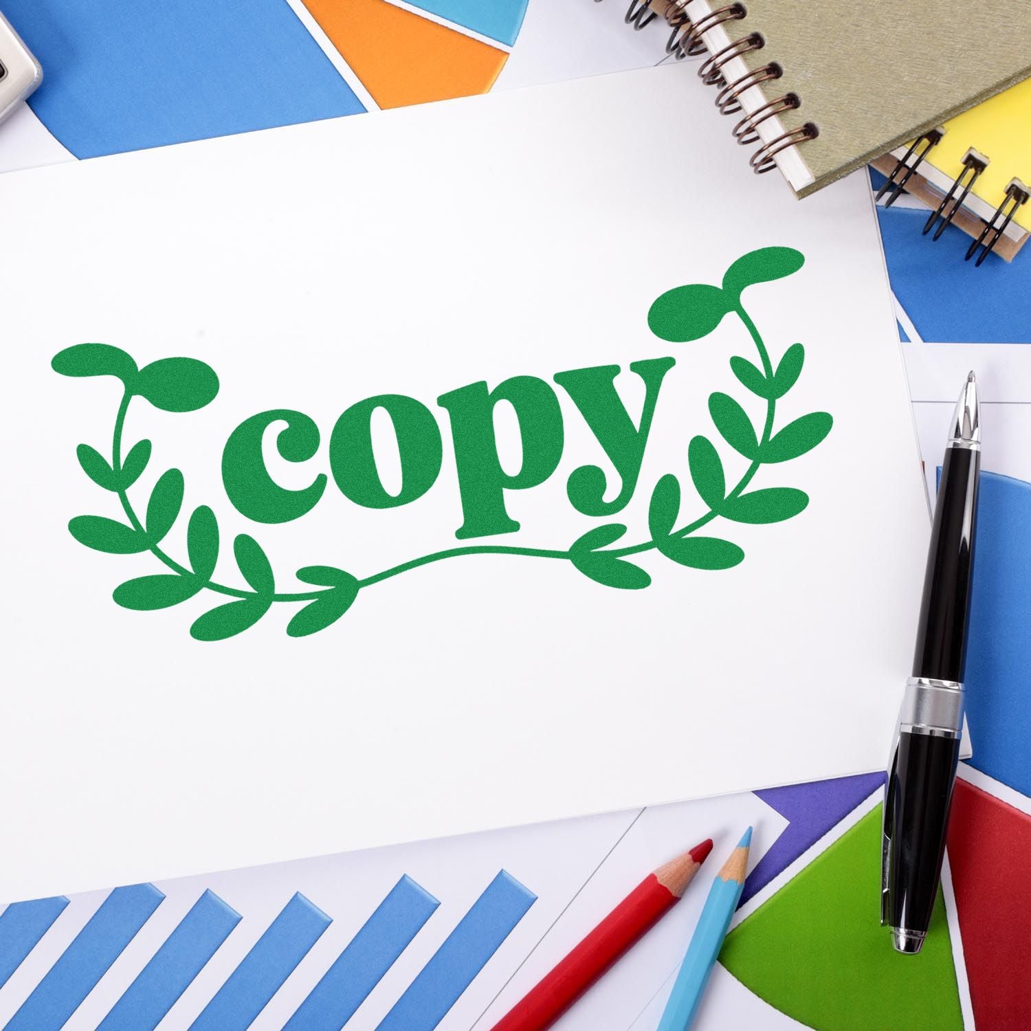 Green copy rubber stamp on paper with office supplies, ideal for document marking and office use.