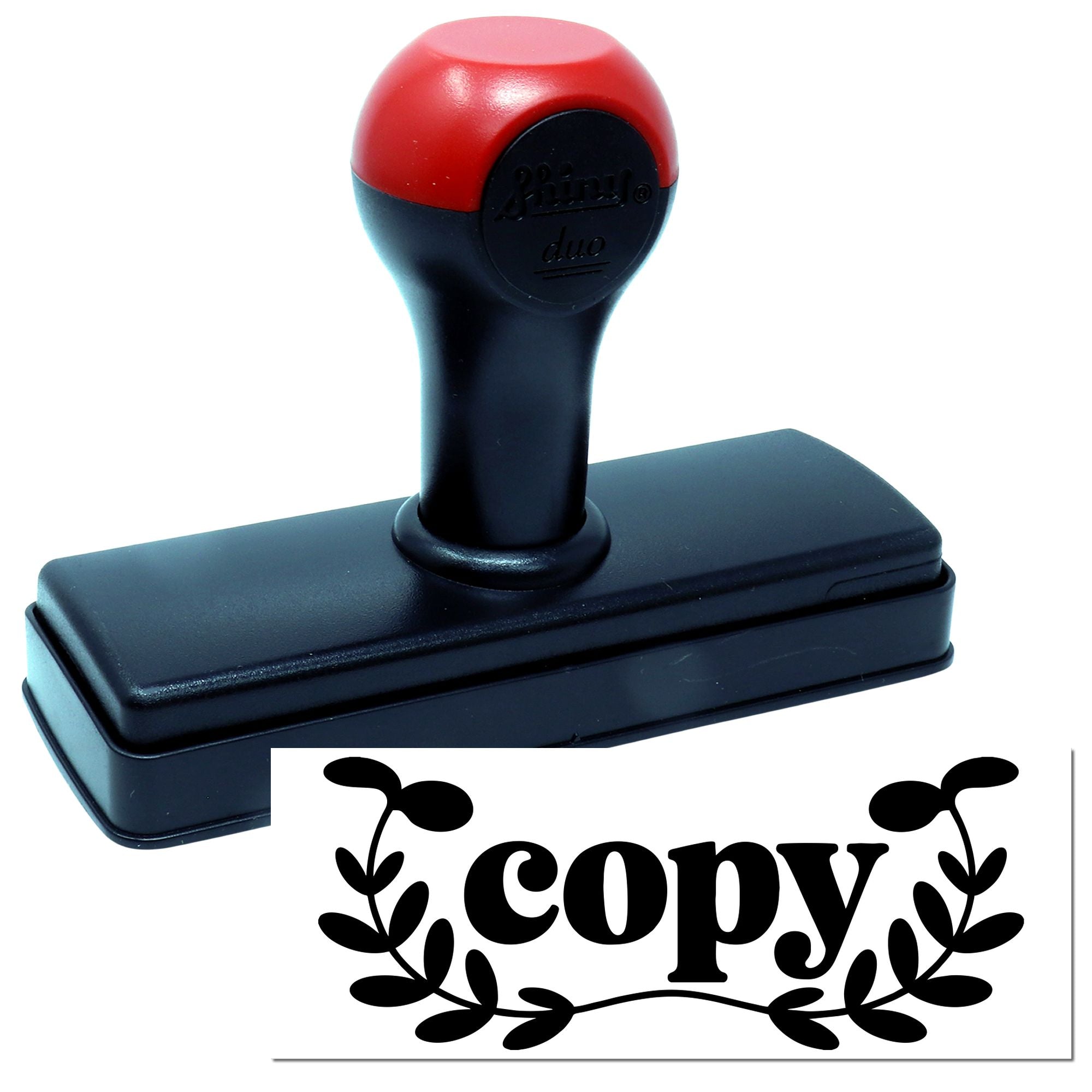 Self-inking rubber copy stamp for marking duplicate documents and office paperwork.