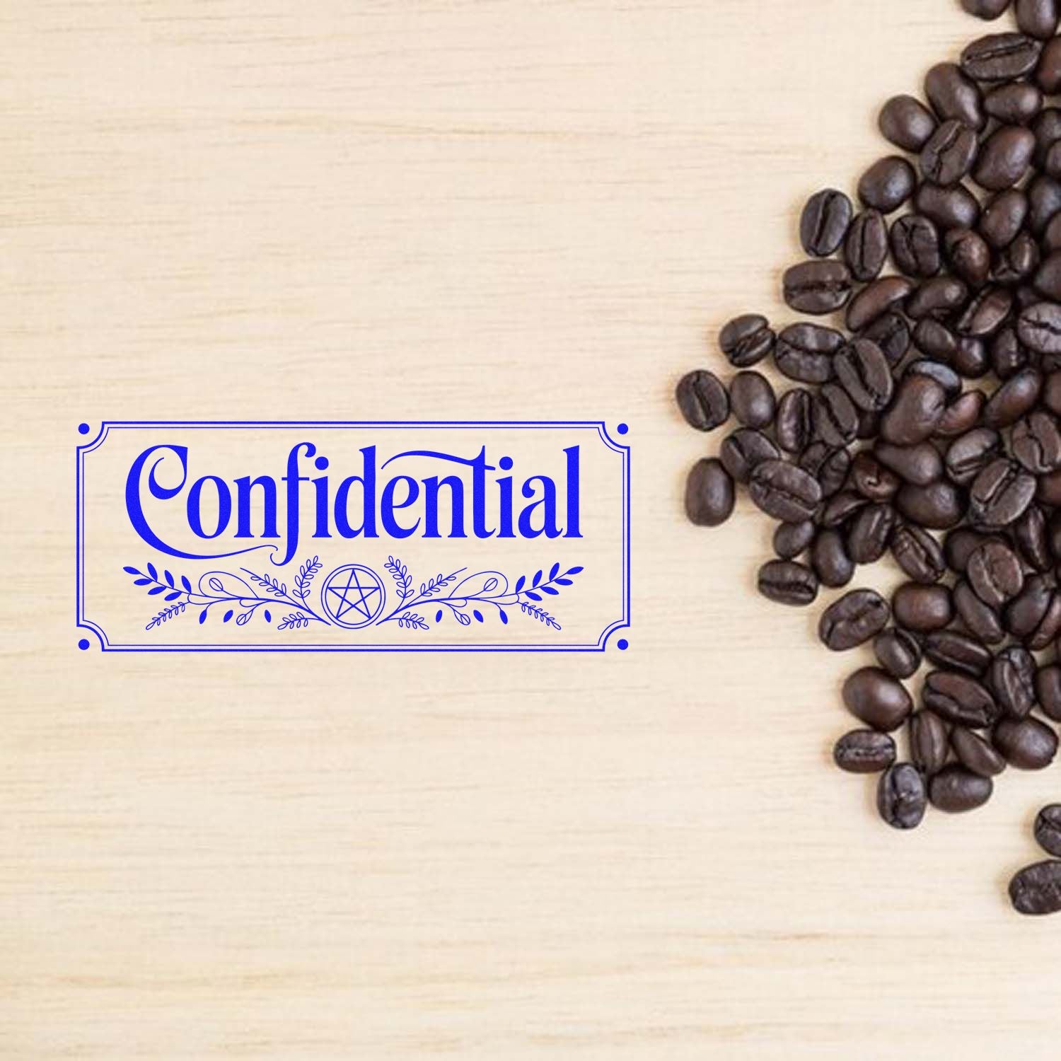 Confidential rubber stamp design with decorative border, shown on a wood background beside coffee beans.