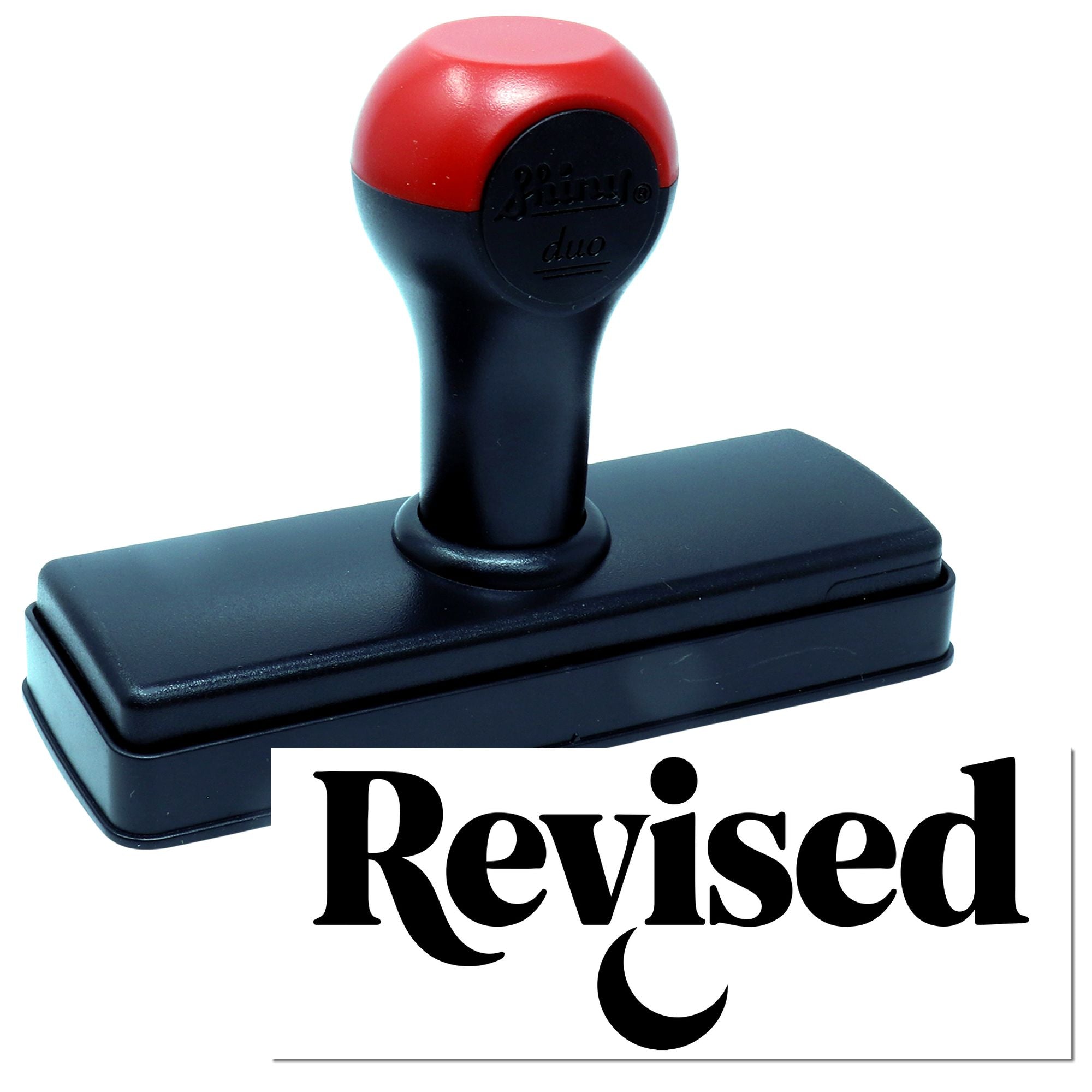 Self-inking rubber stamp with Revised impression for office document marking and approval tracking.