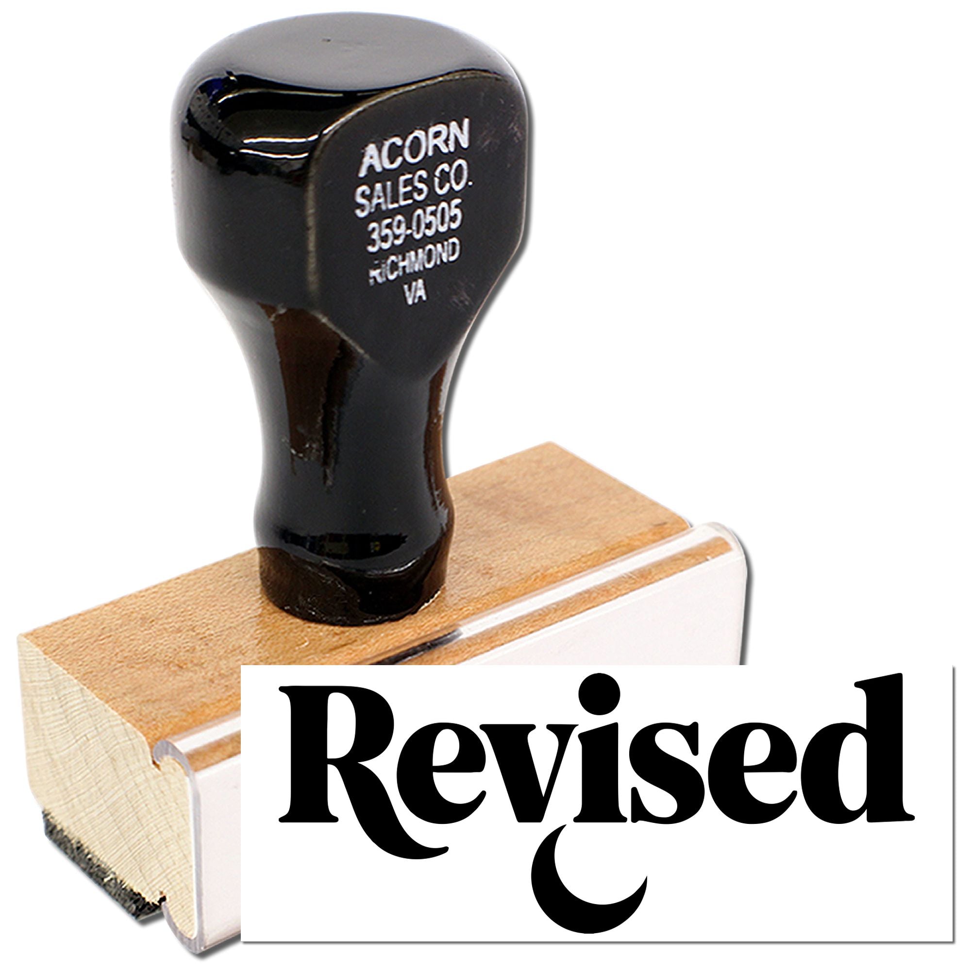 Revised rubber stamp for marking documents, forms, and office paperwork during review.