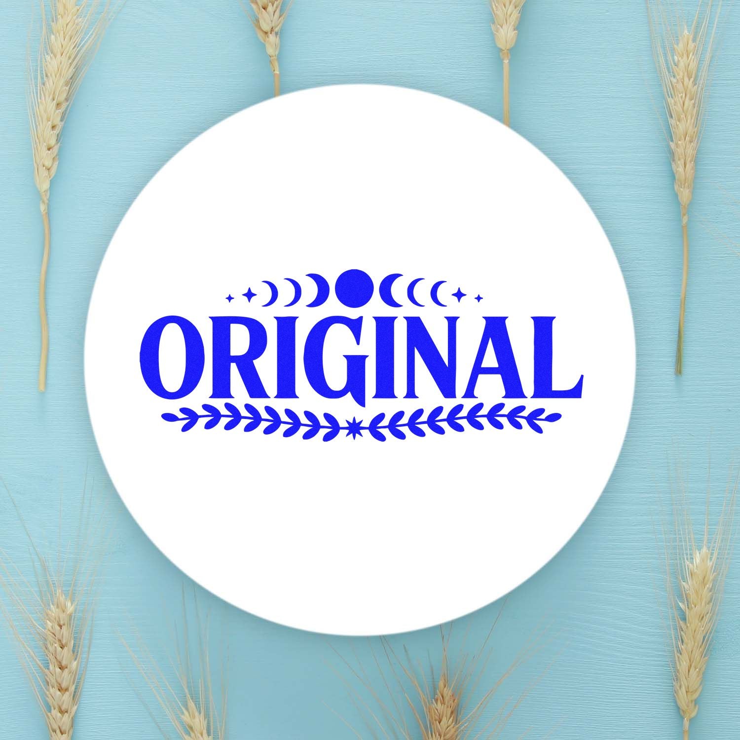 Original decorative rubber stamp design with moon phases and leaf accents in bold blue on a circular white background.