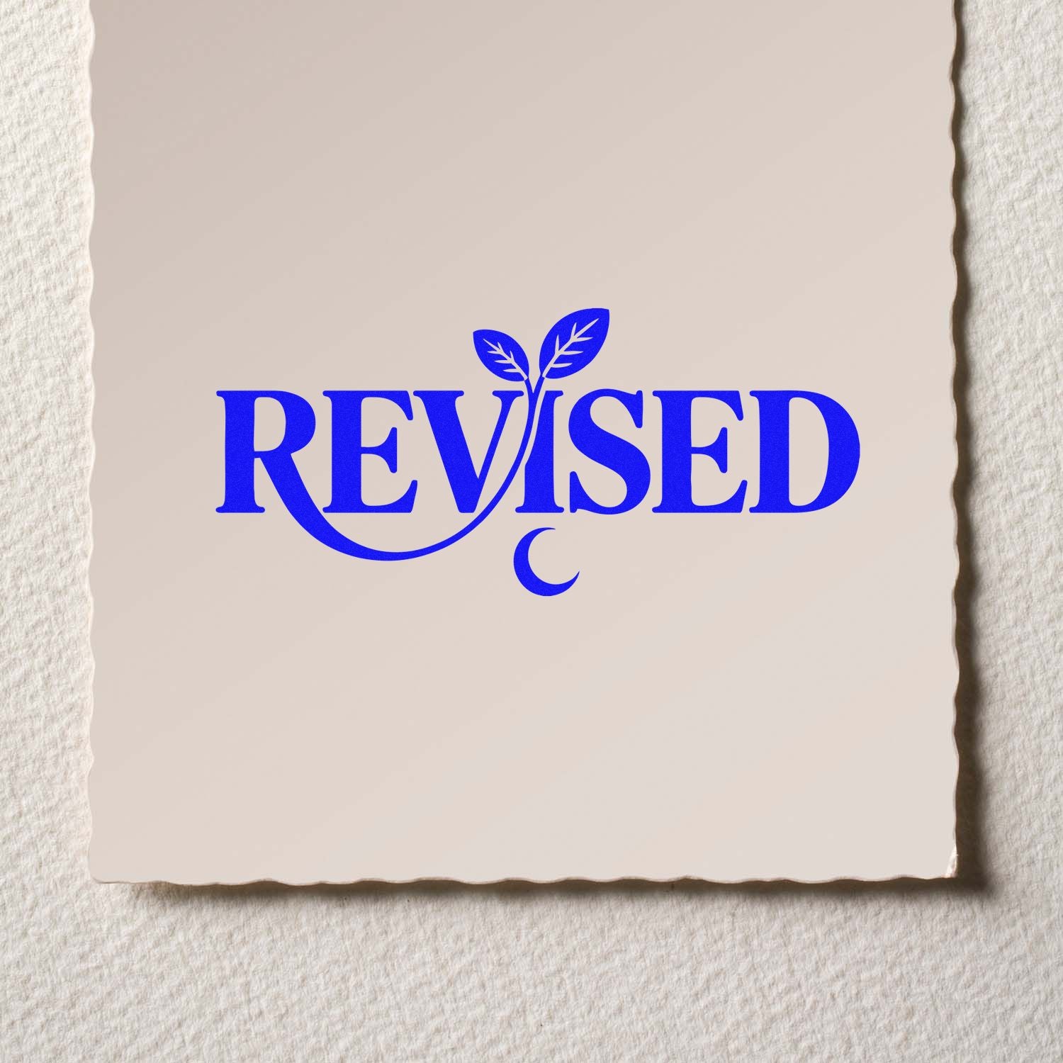 Revised rubber stamp design with leaf accent for document review and approval.