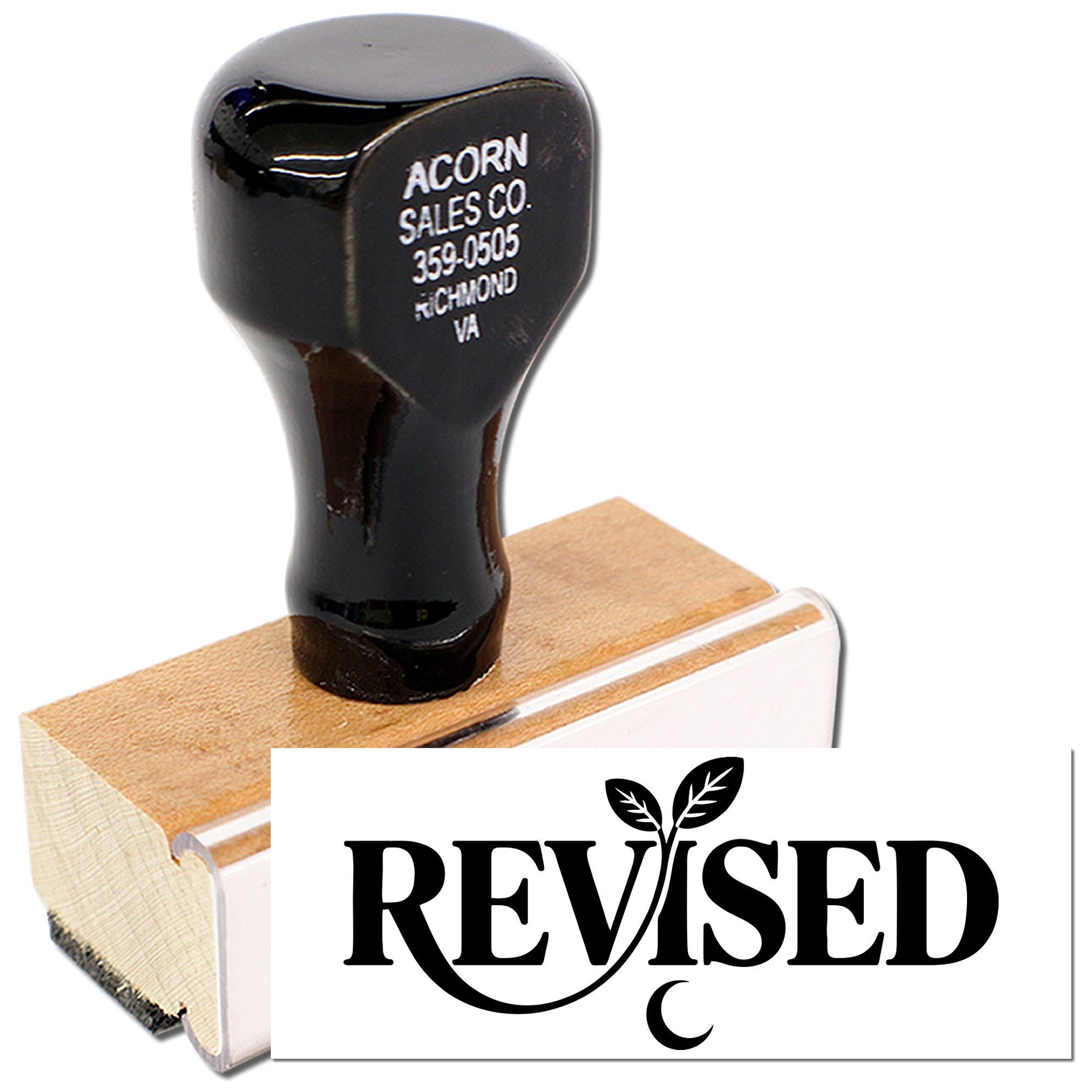 Custom REVISED rubber stamp with wooden handle for office paperwork and document approval marking.