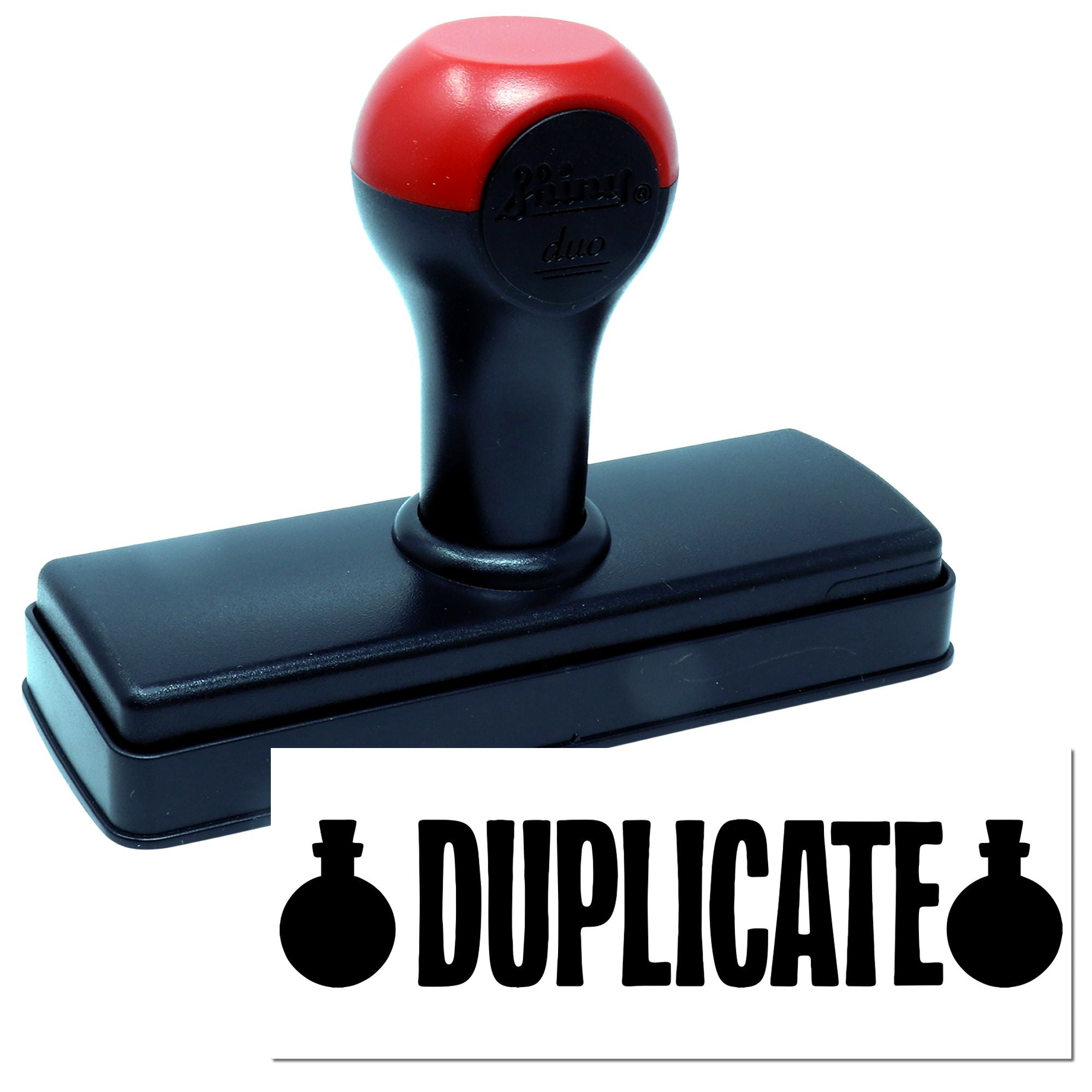 Self-inking duplicate rubber stamp with red handle for marking documents as duplicate.