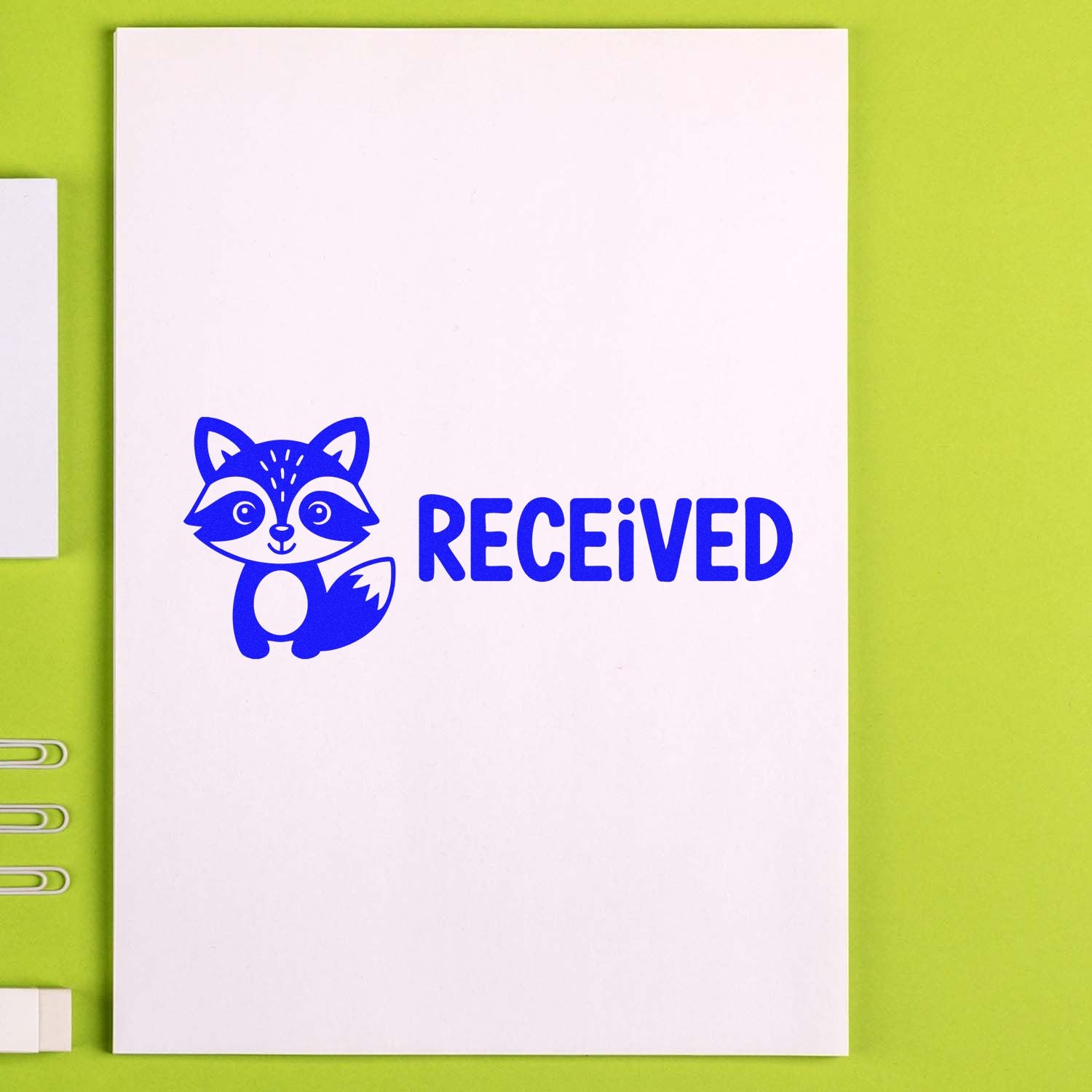 Blue raccoon Received rubber stamp on white paper for office mail, approvals, and inventory tracking.