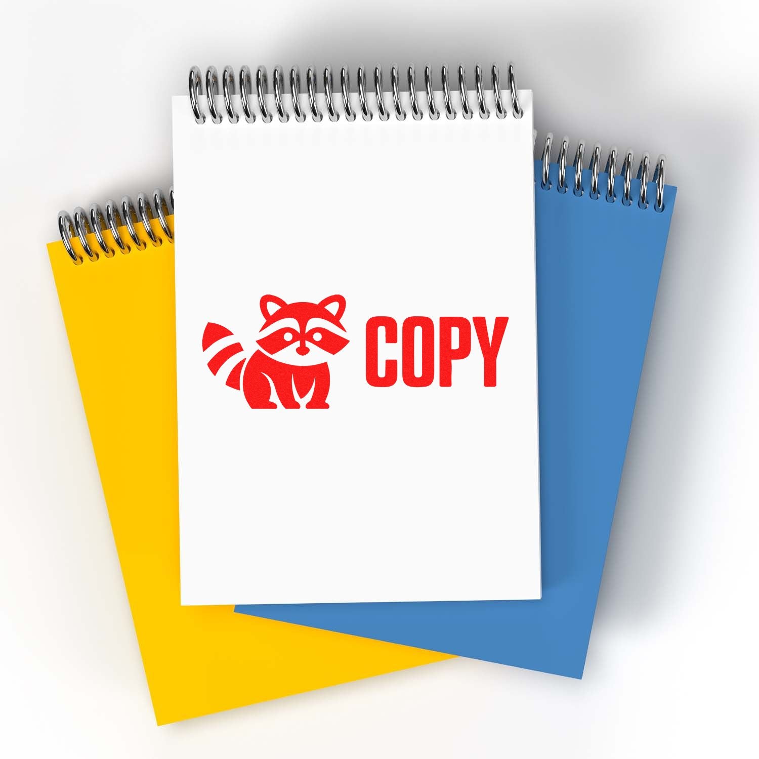 Red COPY raccoon rubber stamp on spiral notebook for office document labeling