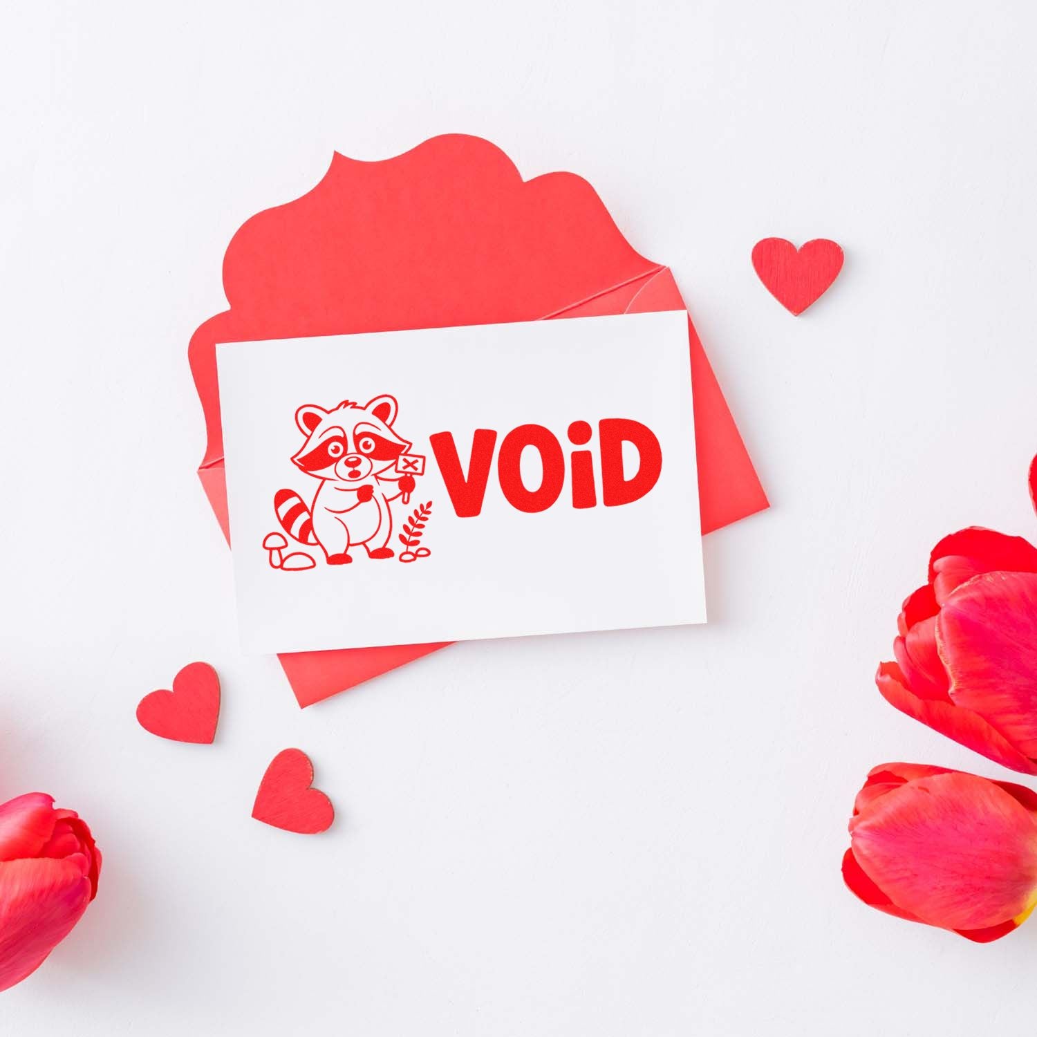 Red VOID rubber stamp with raccoon design, ideal for marking documents, packaging, and novelty stationery.