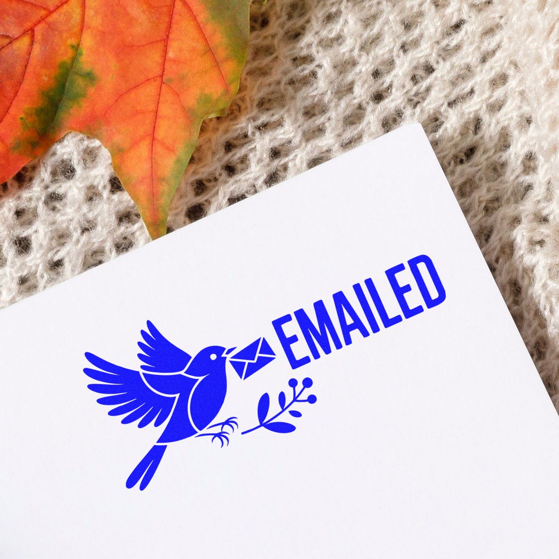 Blue bird EMAILED rubber stamp with envelope icon for office paperwork, mailing confirmation, and document status.