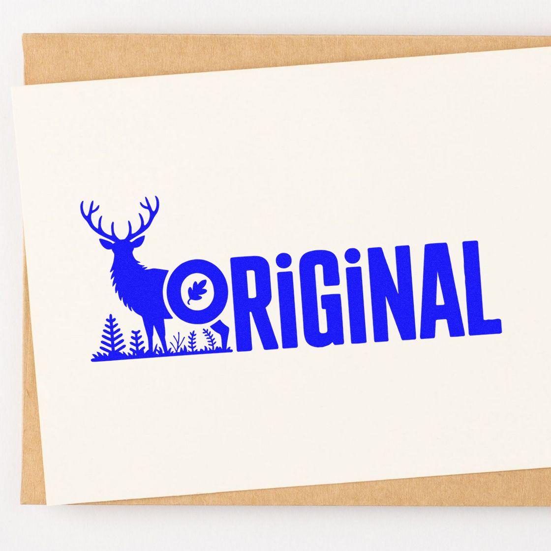 Blue original deer rubber stamp design on paper, ideal for custom branding, handmade packaging, and nature-themed stamps.