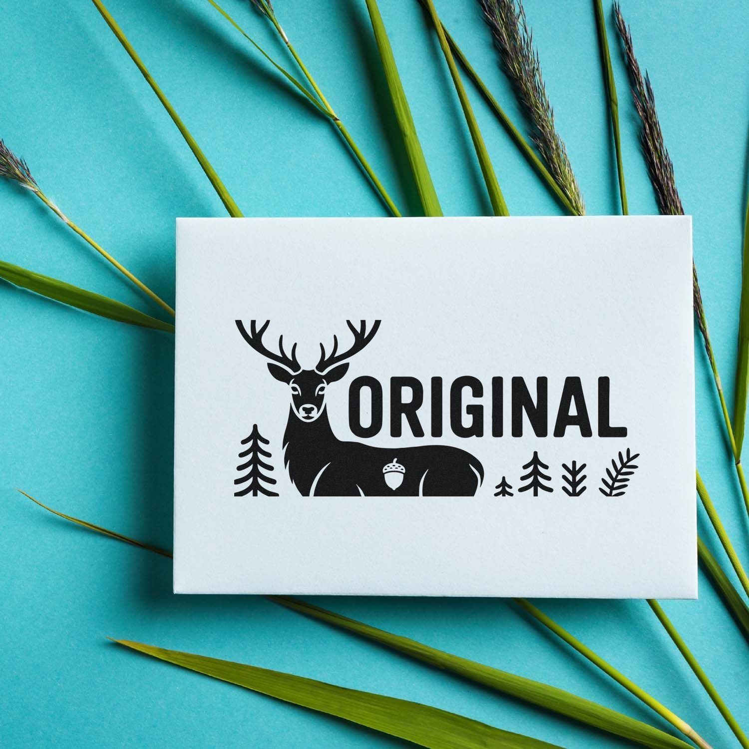 Custom deer ORIGINAL rubber stamp design for rustic branding, with forest accents on a white card.