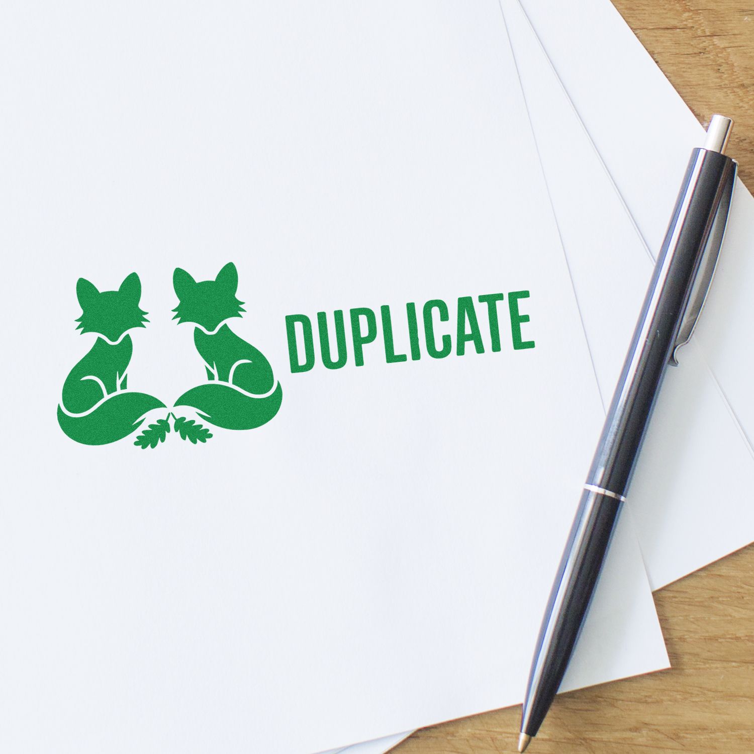 Duplicate rubber stamp with twin fox logo on paperwork, perfect for office document and branding use.