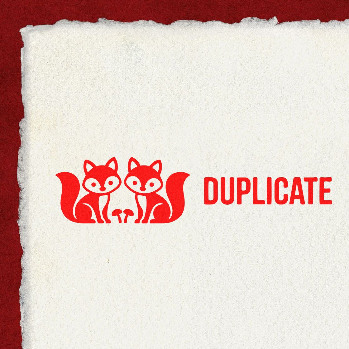 Red duplicate rubber stamp design with twin fox icon for marking duplicate documents and office copies.