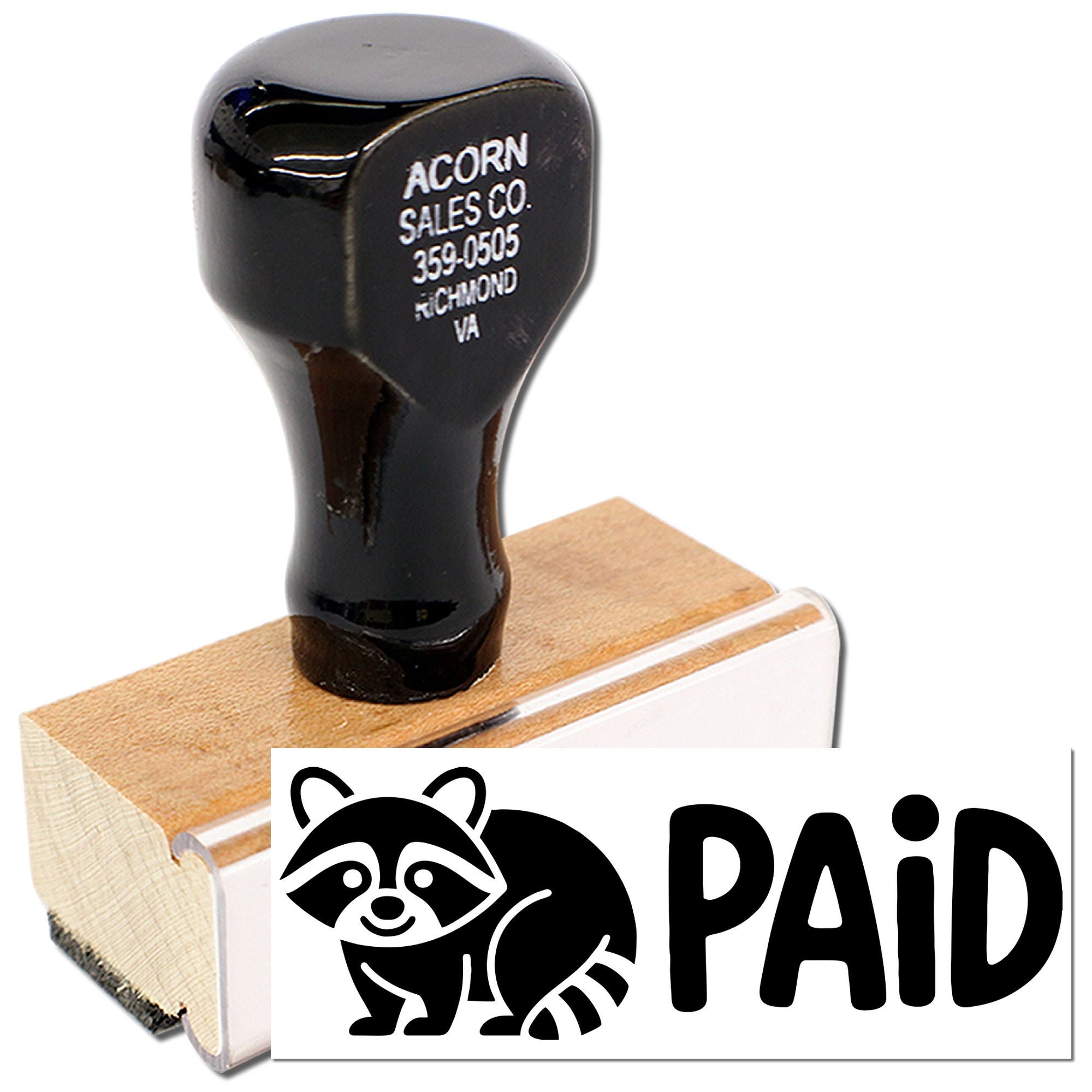 Custom PAID rubber stamp with raccoon logo for marking invoices and receipts in the office.