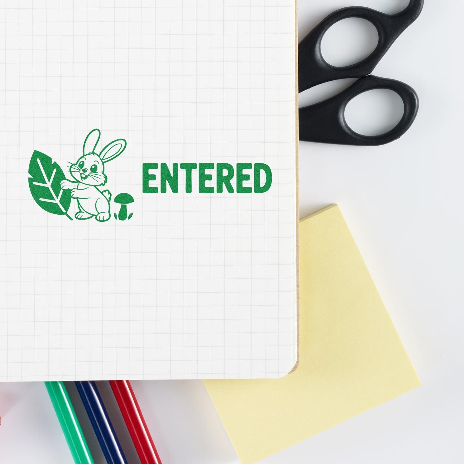 Custom rubber stamp with bunny and leaf design reading ENTERED for office filing, crafts, and organization.