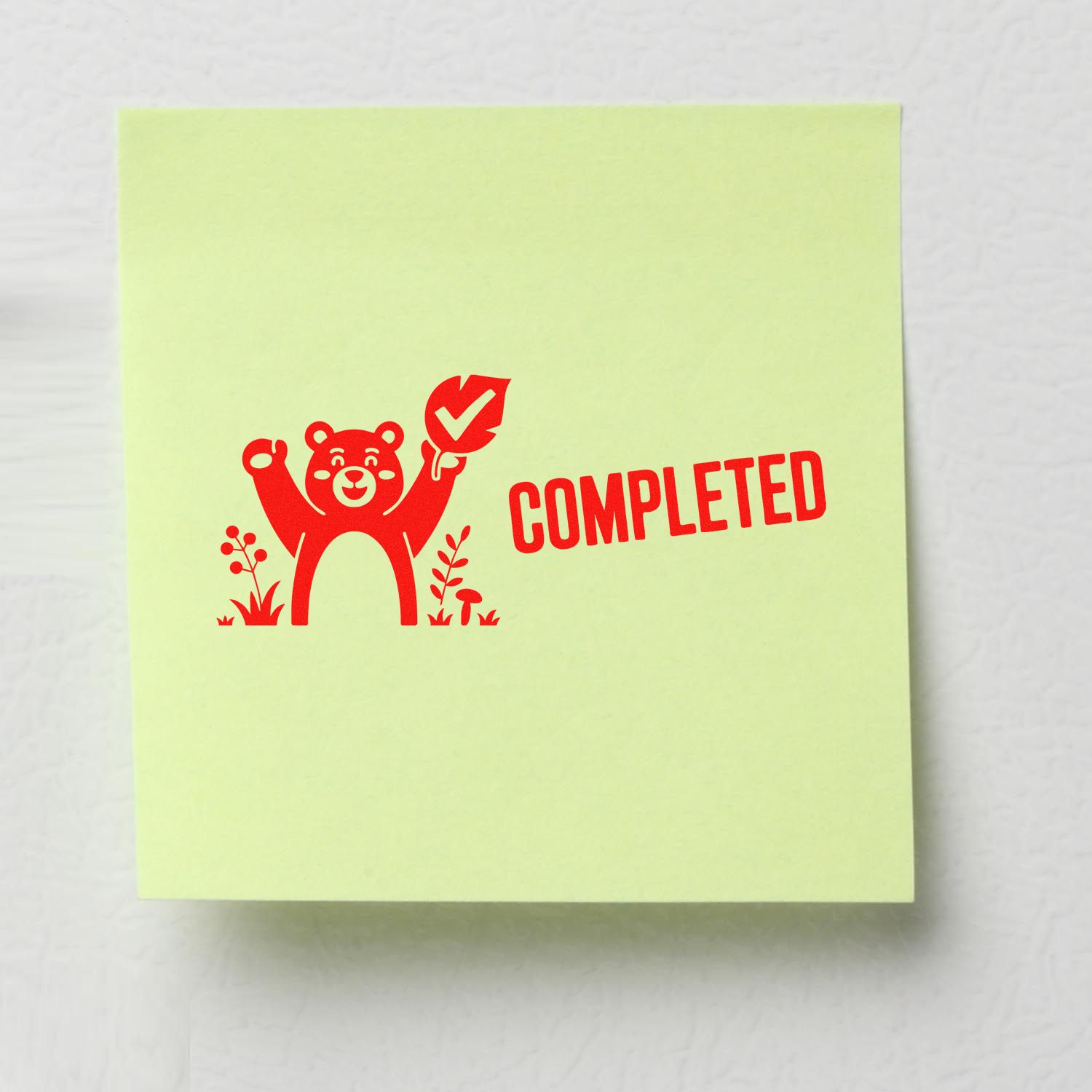 Completed rubber stamp design with bear and checkmark for marking tasks finished