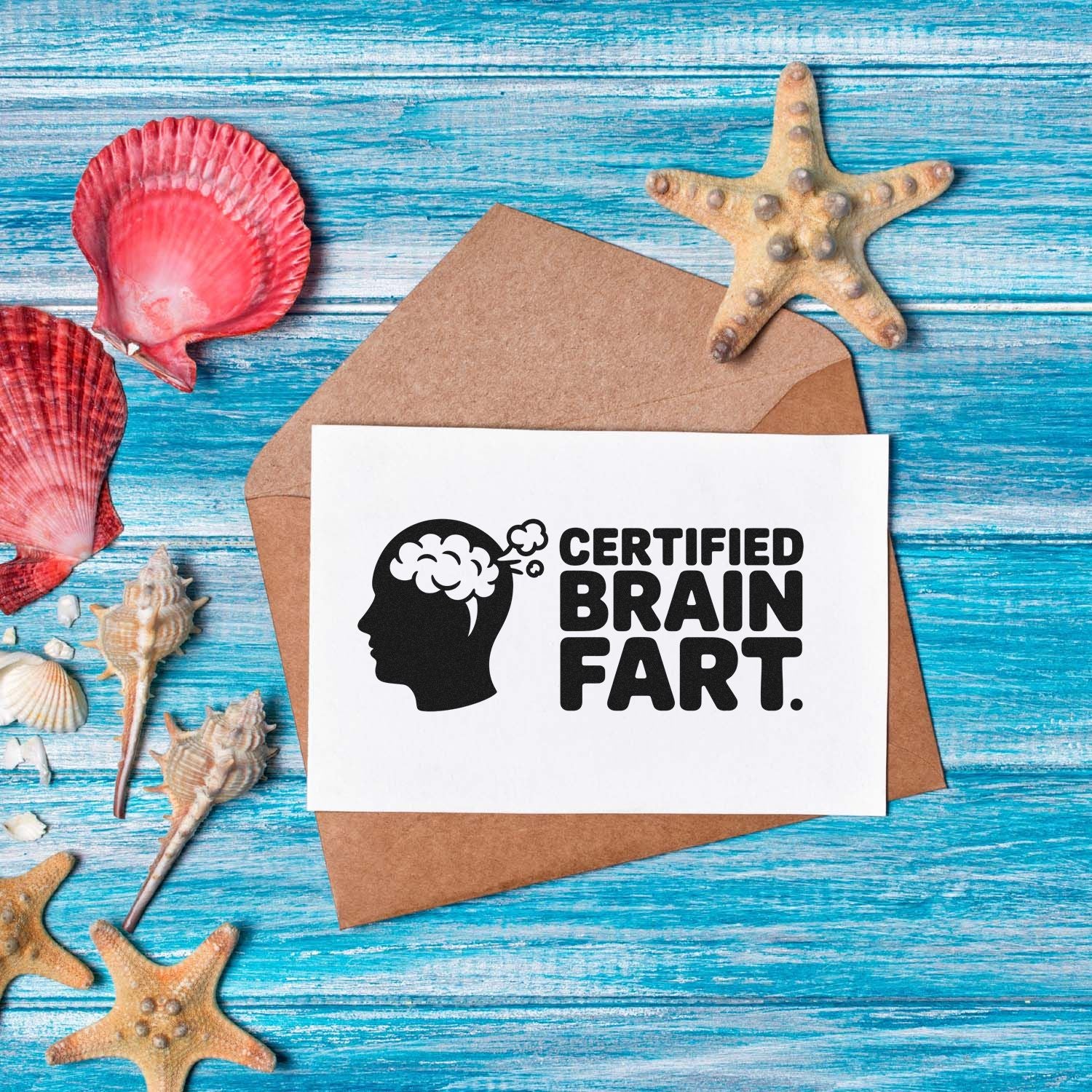 Funny beach-themed rubber stamp design reading Certified Brain Fart on a greeting card with seashells and starfish.