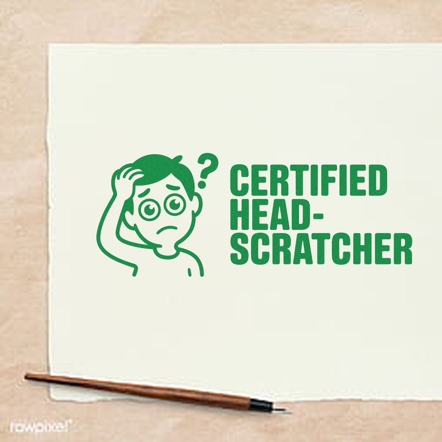 Custom rubber stamp with green Certified Head-Scratcher design and confused cartoon on paper.