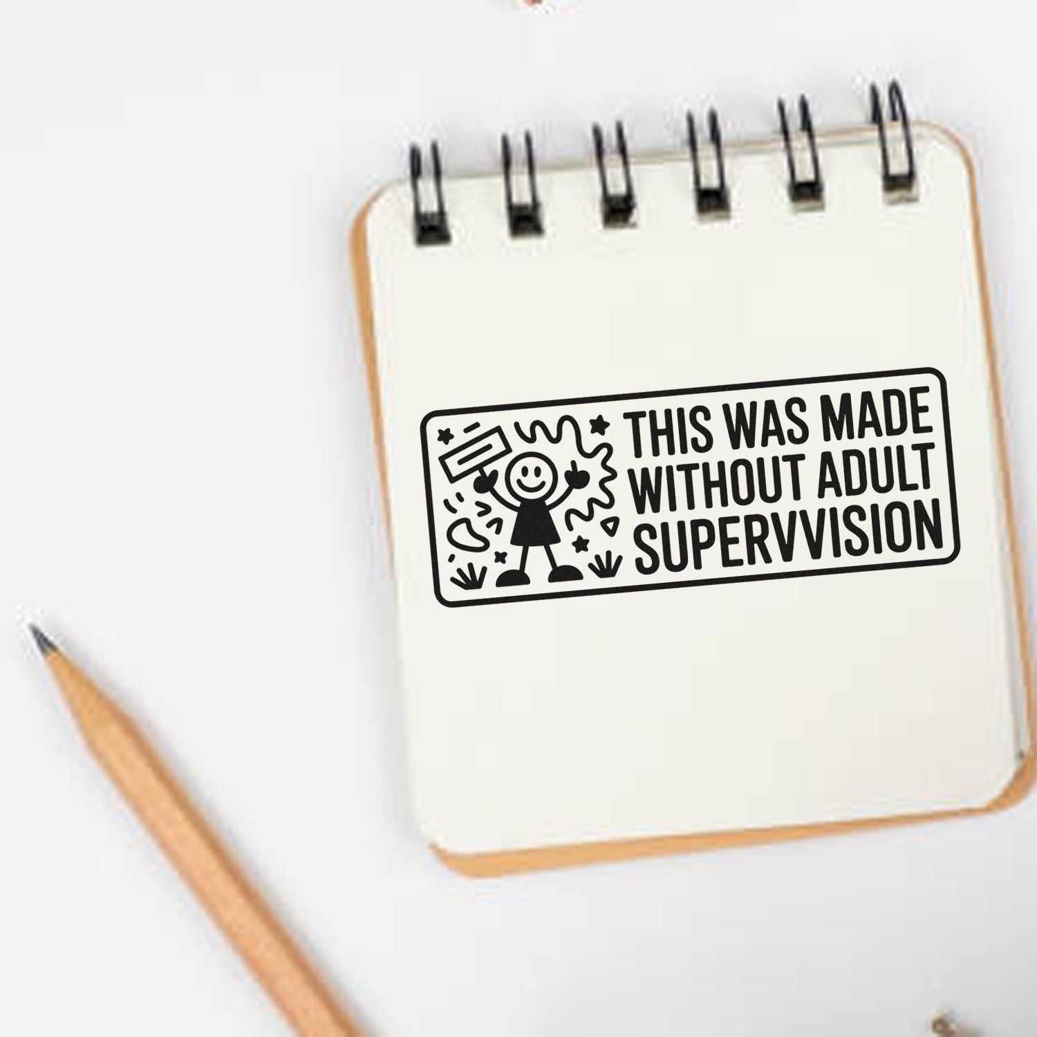 Funny rubber stamp on notebook reading This was made without adult supervision for handmade crafts and creative projects.