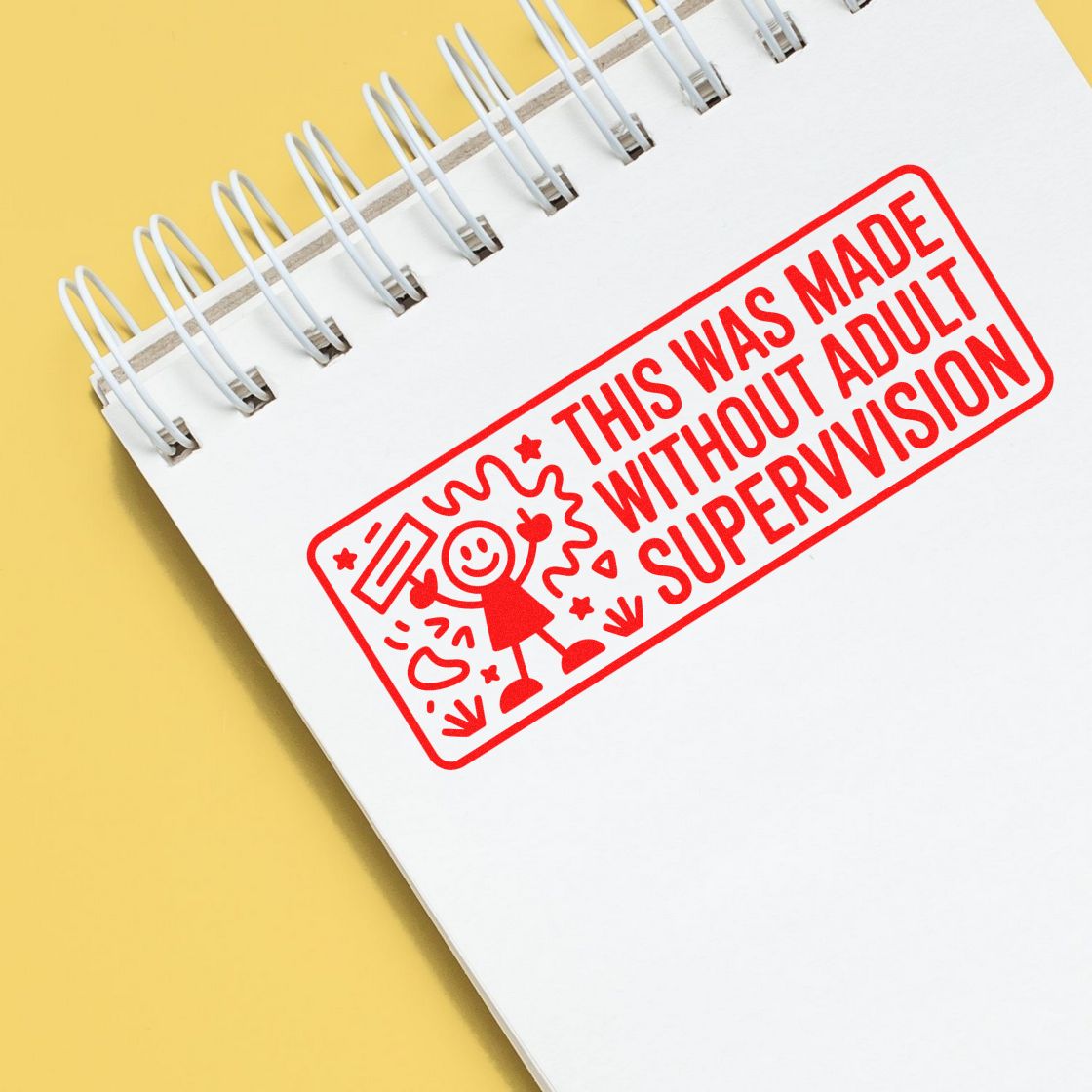 Custom rubber stamp reading This was made without adult supervision on a notebook, ideal for novelty craft branding.