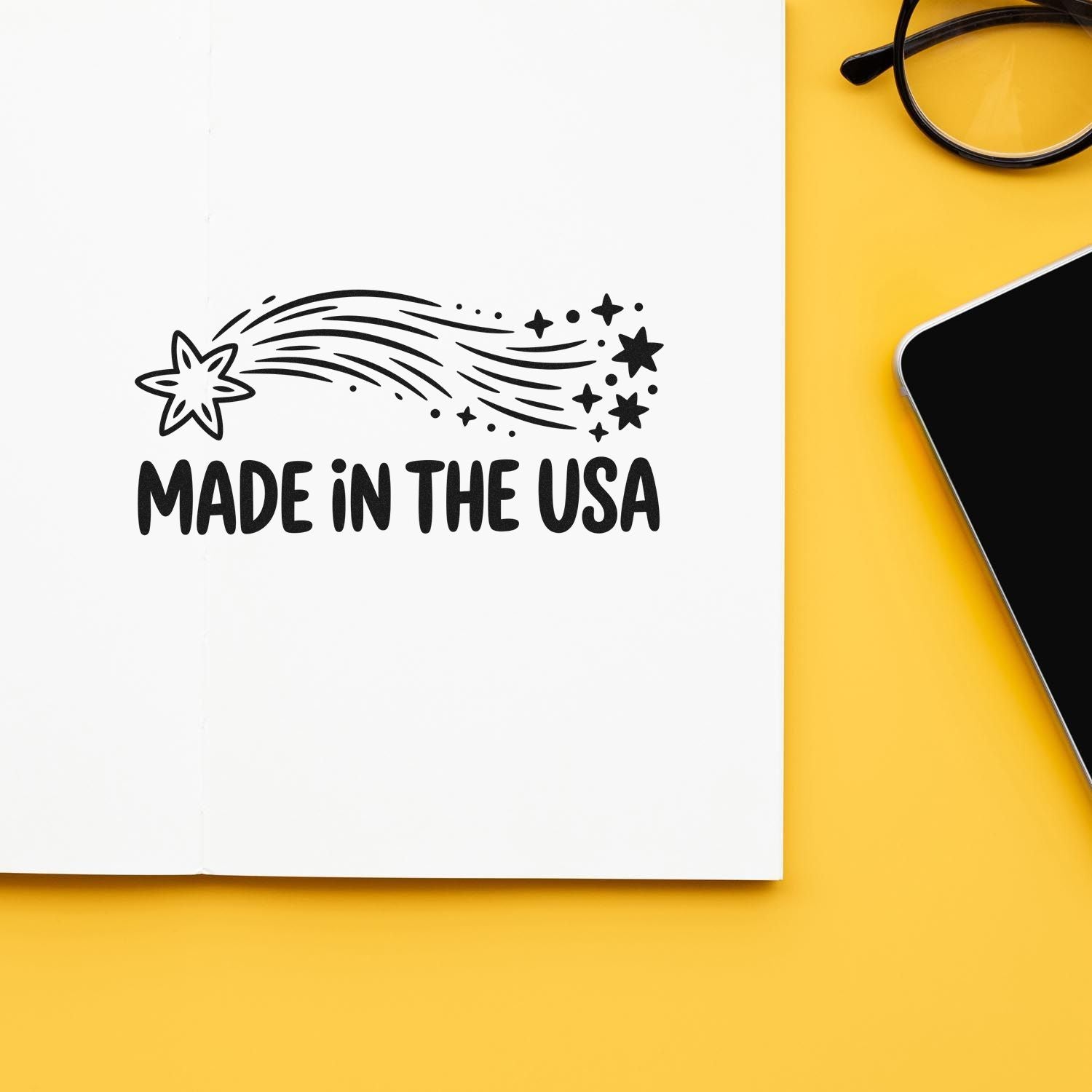 Made in the USA rubber stamp design on notebook, ideal for product branding and patriotic packaging.