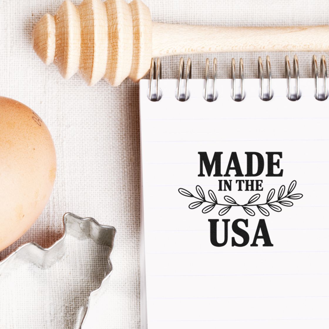Made in USA rubber stamp design on notebook with rustic baking tools and wooden honey dipper, ideal for custom stamp branding.