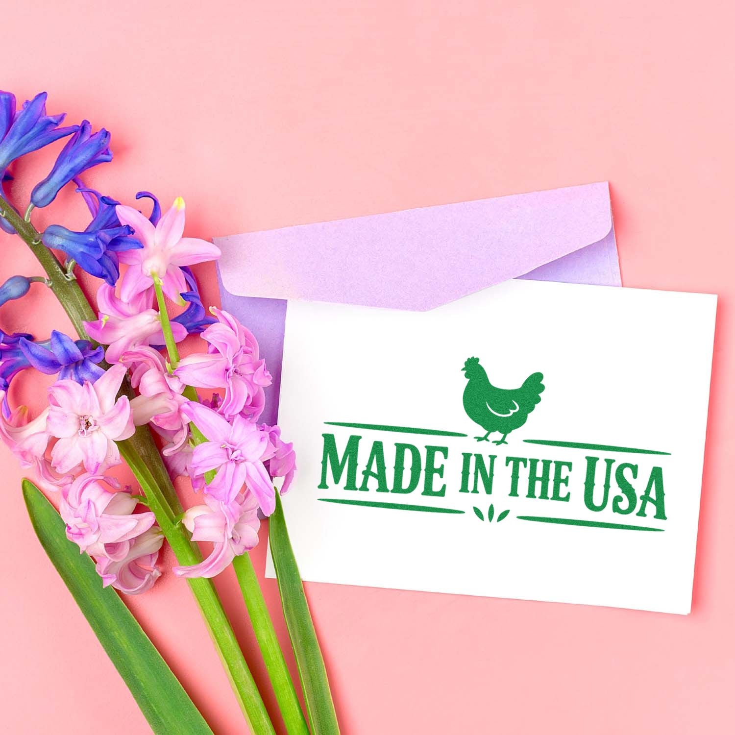 Made in the USA rubber stamp on a greeting card with envelope and flowers, ideal for handmade product packaging.