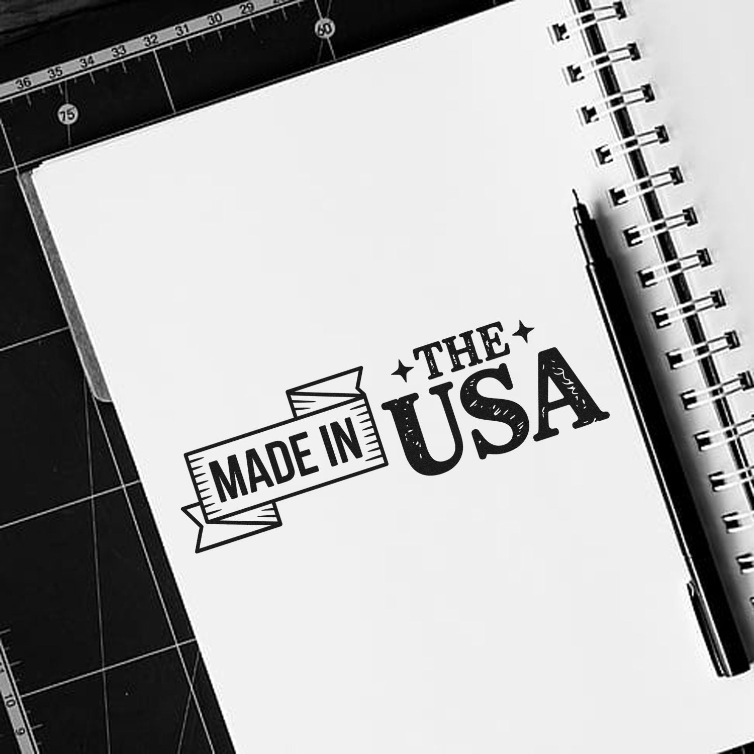 Made in USA rubber stamp impression on notebook page, ideal for handmade product packaging and branding.