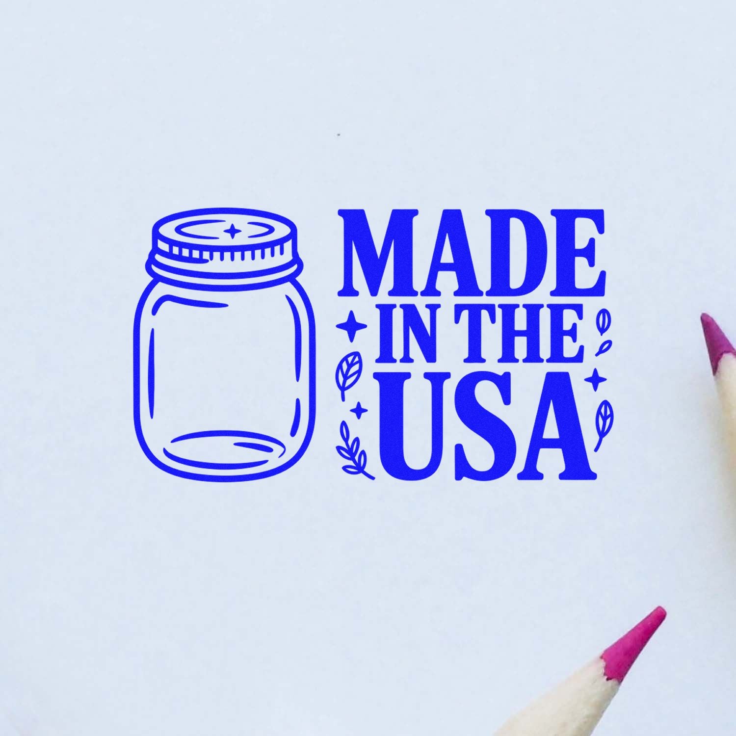 Made in the USA rubber stamp design with mason jar icon and decorative leaves in bold blue.