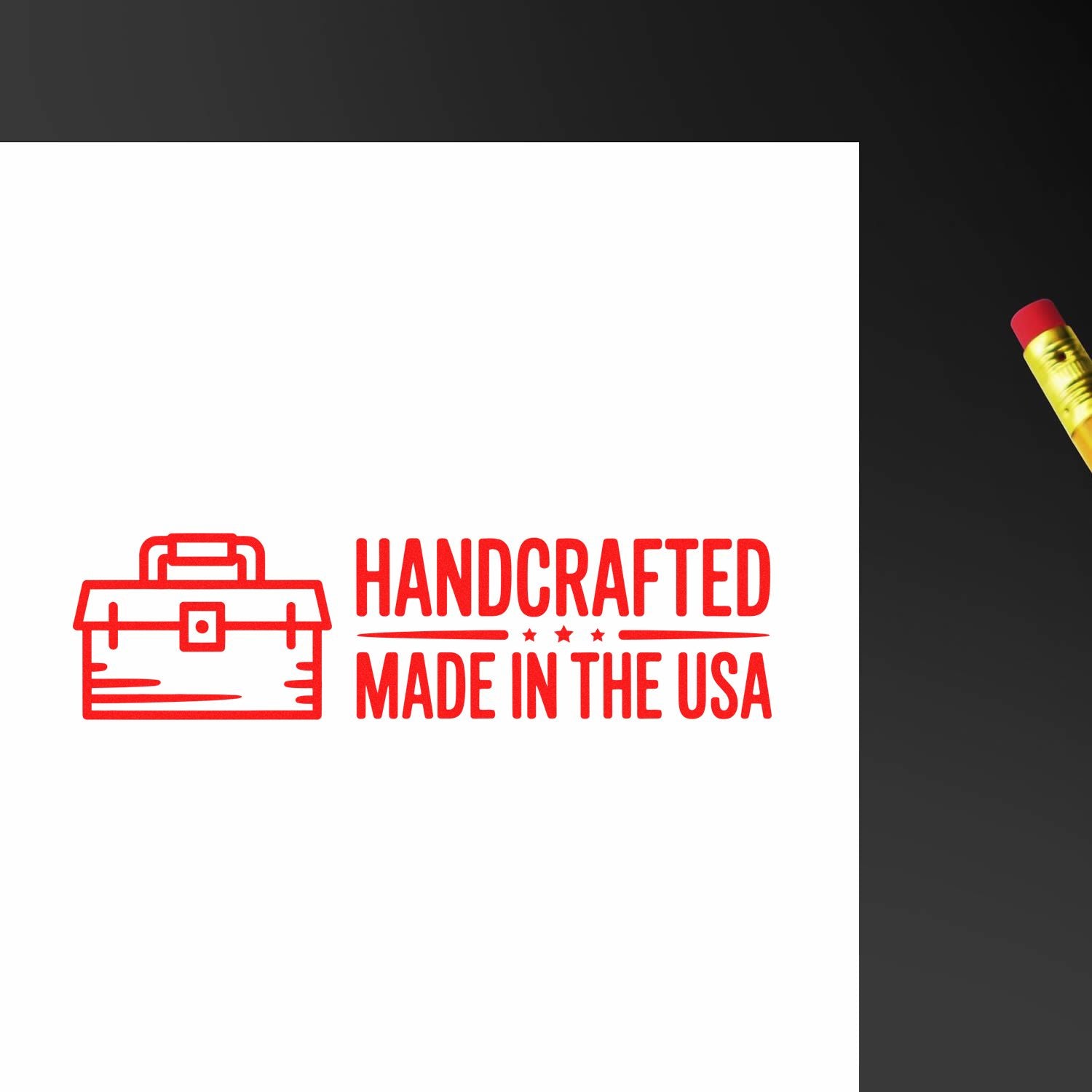 Handcrafted Made in the USA rubber stamp with toolbox icon, red imprint on white paper for handmade product branding.