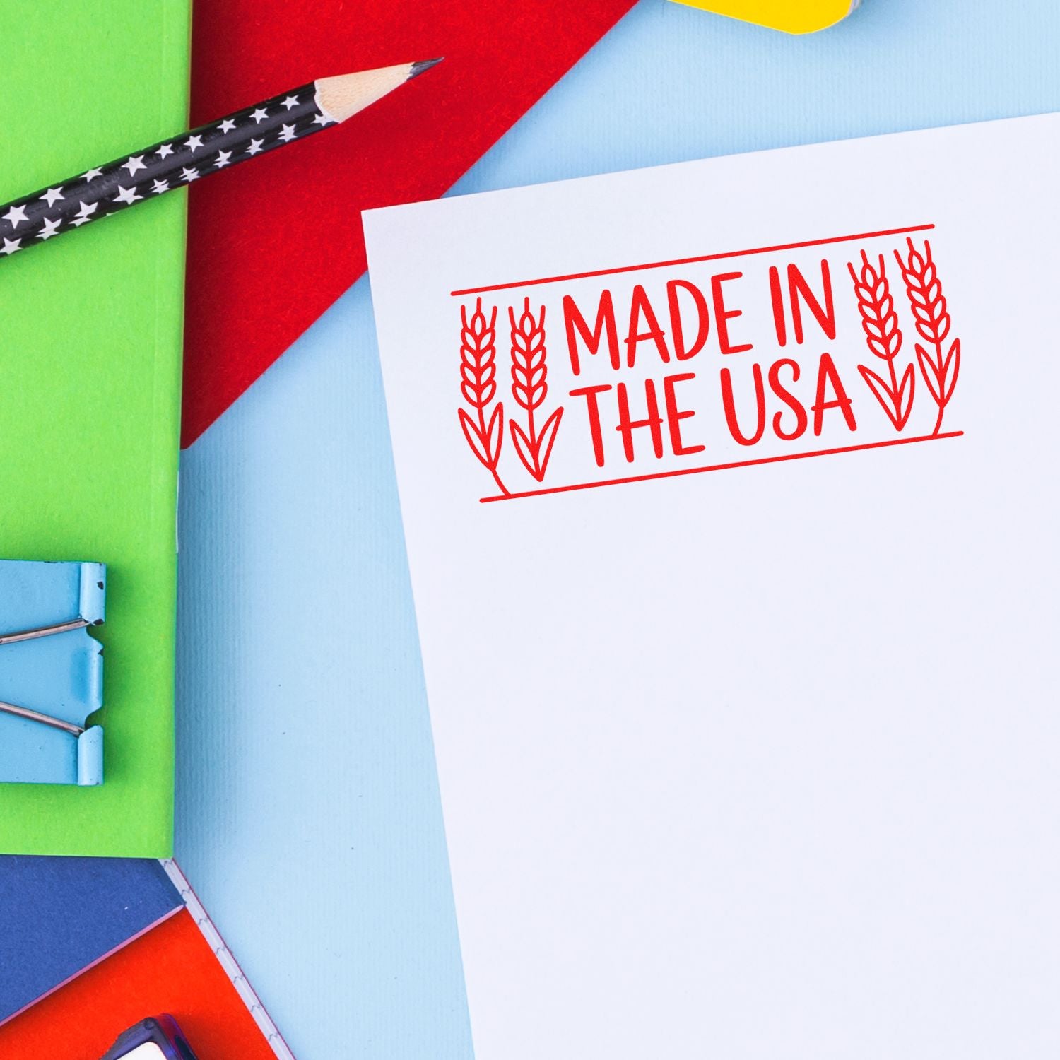 Made in the USA custom rubber stamp imprint on paper with colorful stationery and pencil.