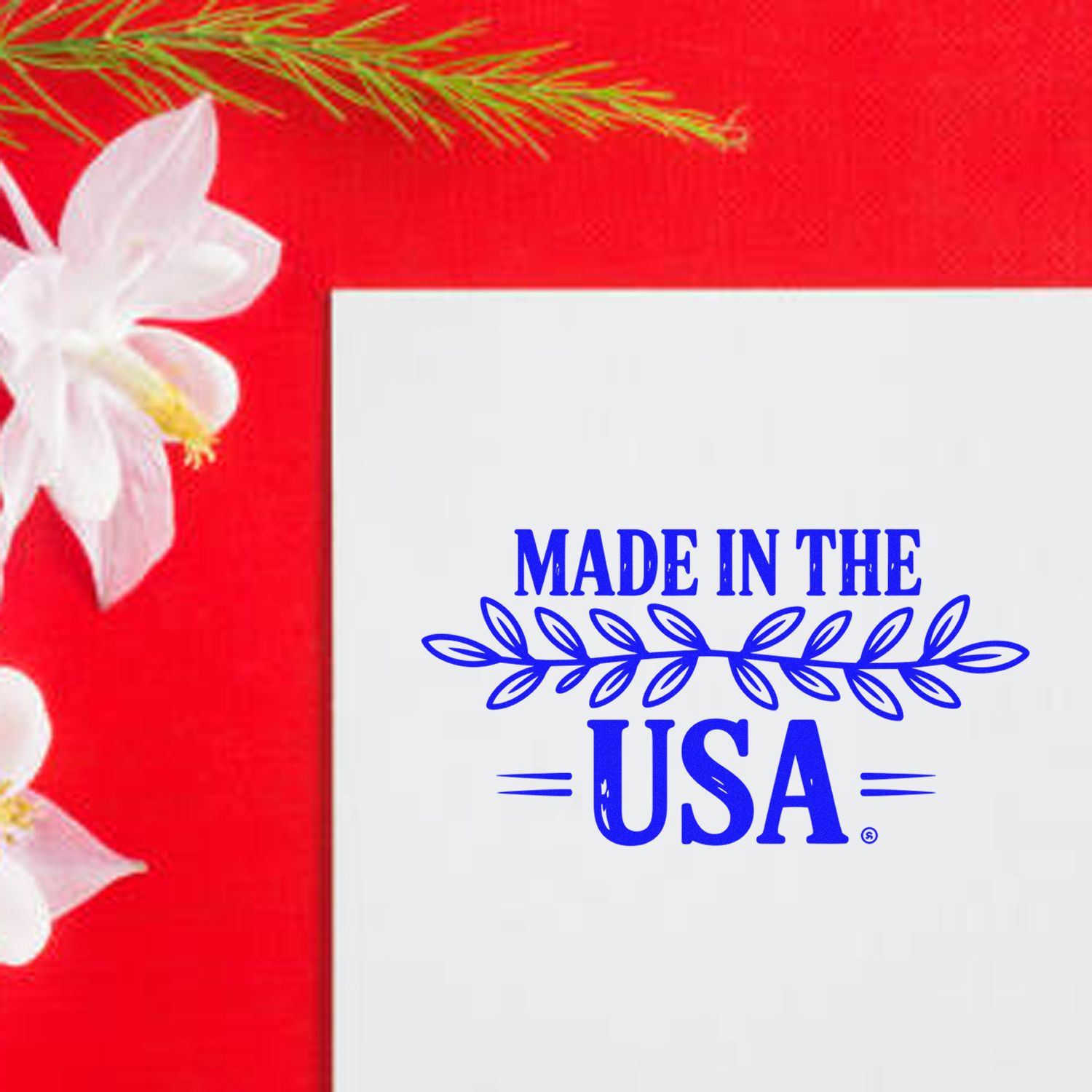 Made in the USA rubber stamp design with blue patriotic text and floral accent for custom product marking