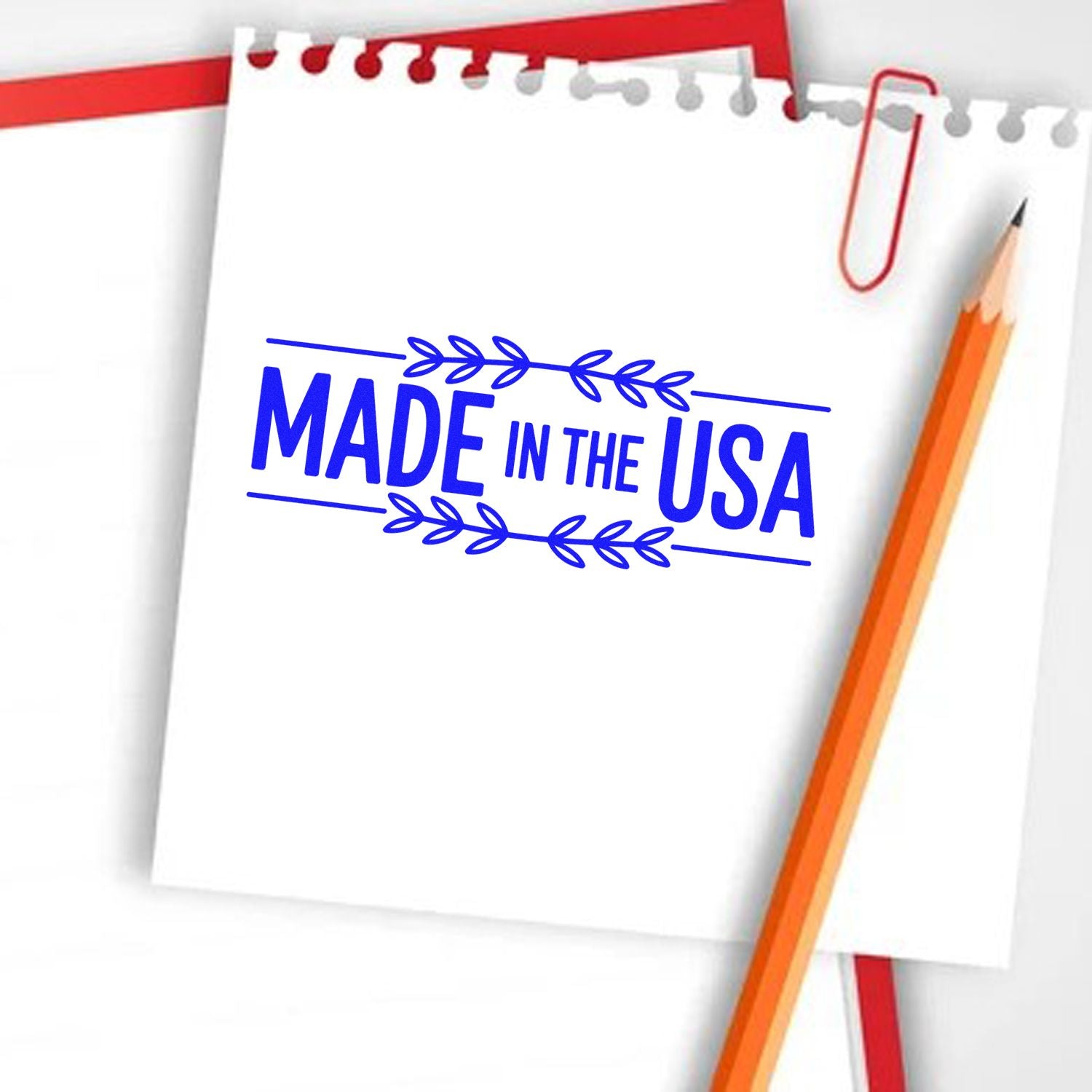 Made in the USA rubber stamp design for product branding, shown on notebook paper with pencil.