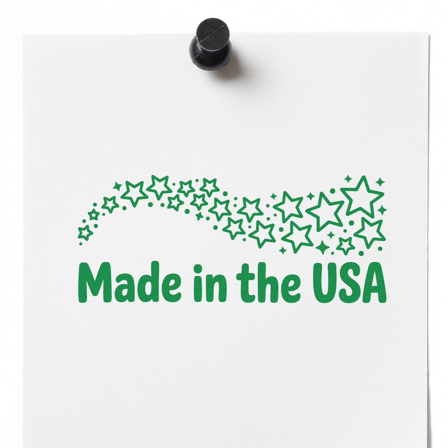 Made in the USA rubber stamp imprint with green stars on white paper for product packaging.
