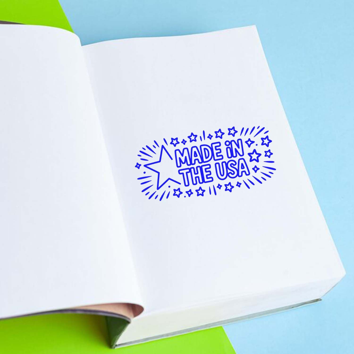 Made in the USA rubber stamp impression on a notebook page for product branding and packaging.