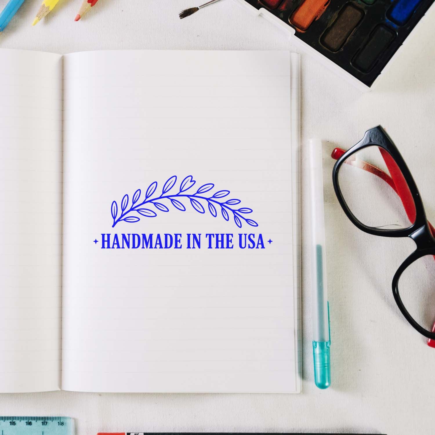Handmade in the USA rubber stamp design with leaf wreath on notebook, ideal for artisan packaging and branding.