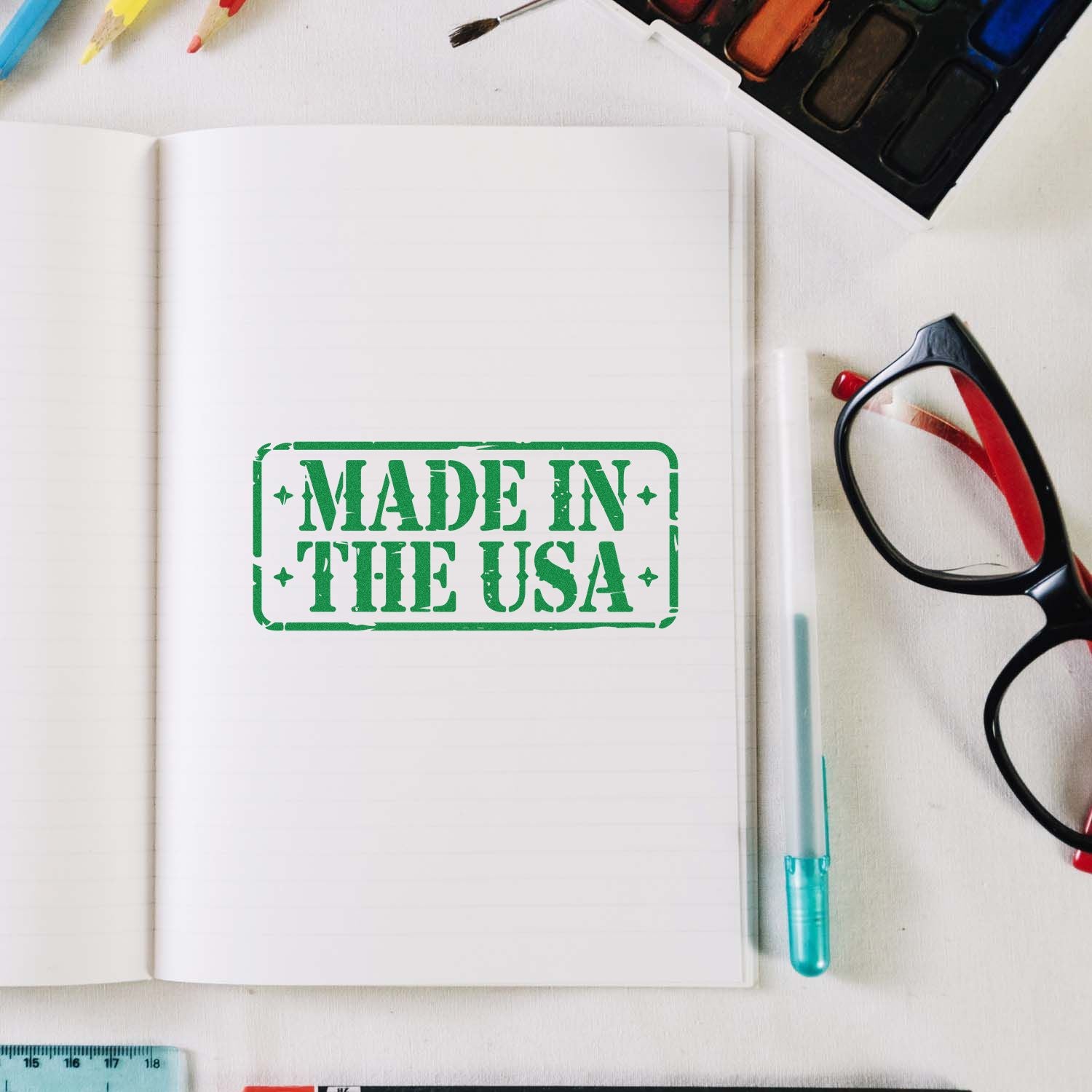 Made in USA rubber stamp impression on open notebook, ideal for crafts, stationery, and custom branding.