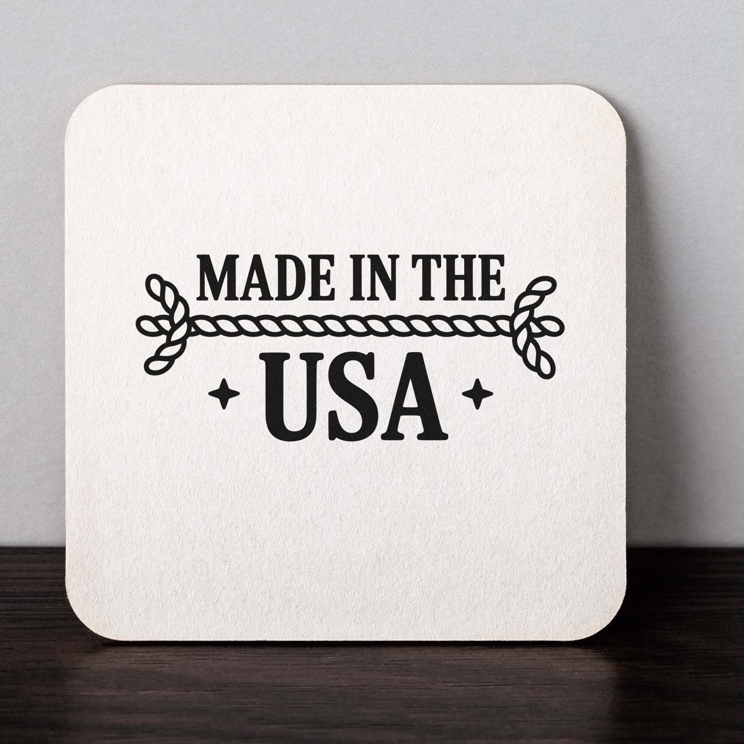 Custom rubber stamp with Made in the USA text and rope border on a white square card.
