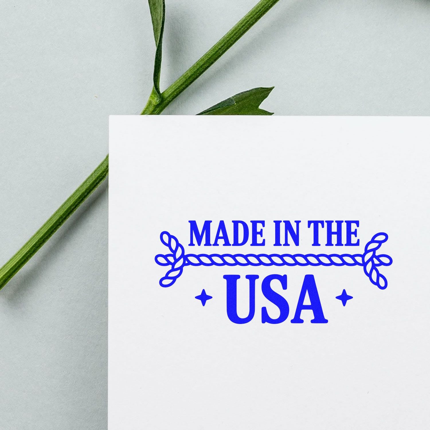 Made in the USA rubber stamp impression in blue on white cardstock, ideal for product packaging and handmade goods.